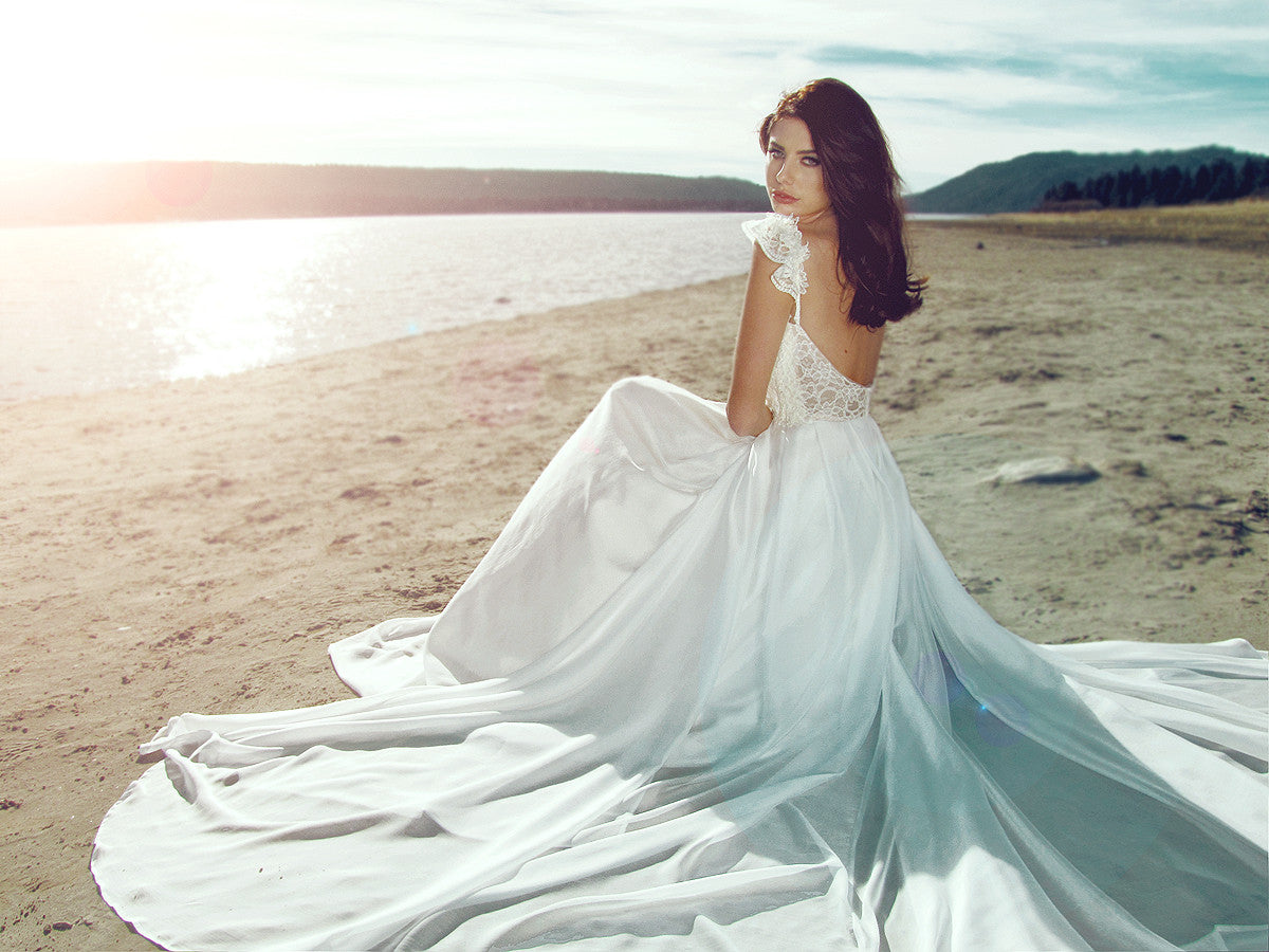 Flowing A-line chiffon and lace draped wedding dress. Illusion backless wedding gown.