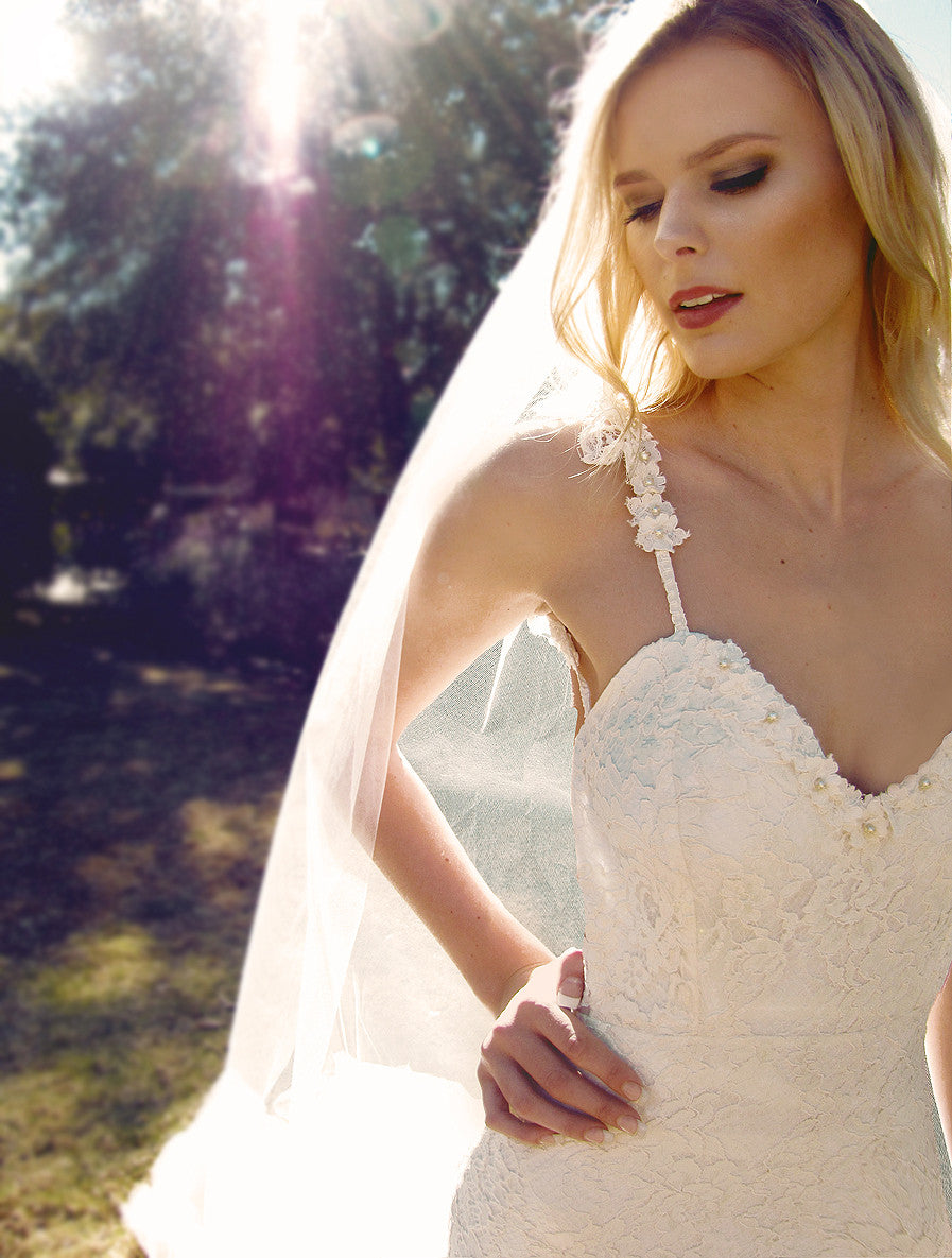 Lace mermaid wedding gown with sleeves.