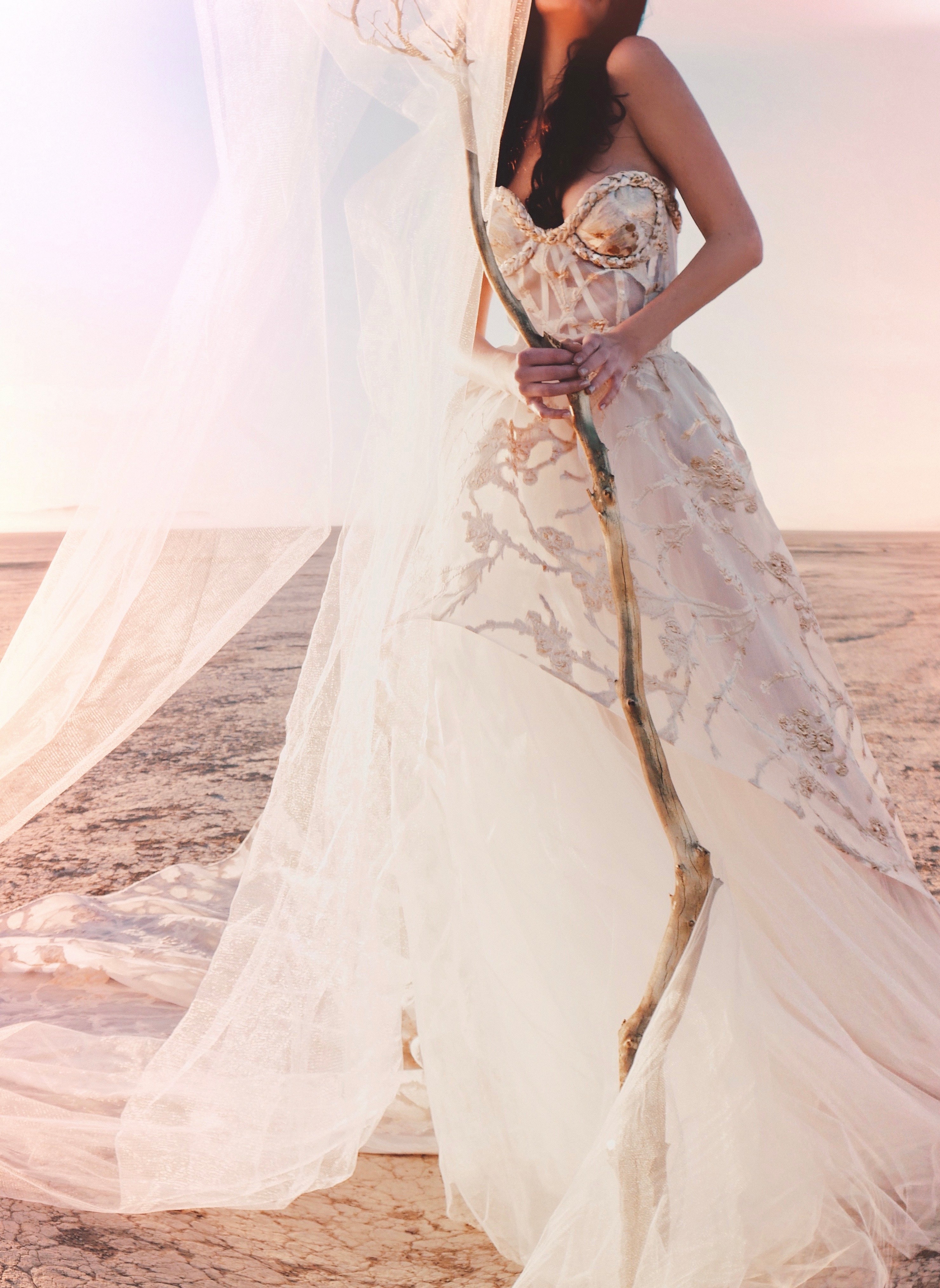 Closeup of gold organza and white tulle skirt with flowing tulle
