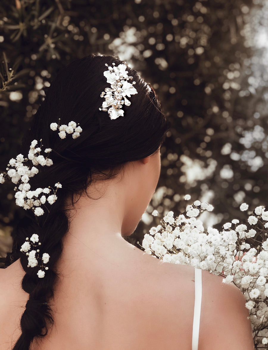 A bride wears the Lauren Elaine "Dewdrop" wedding hair comb in Silver.