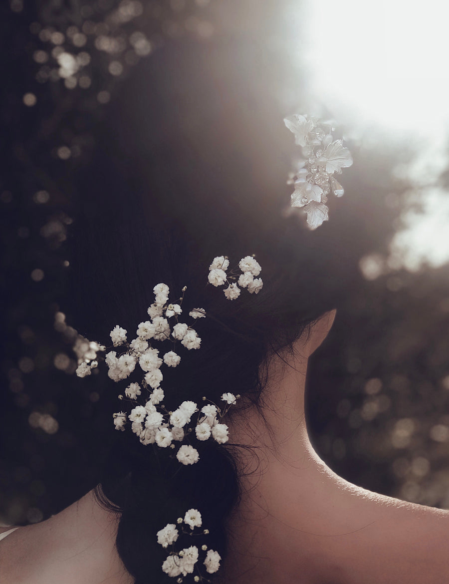 Lauren Elaine Bridal Curated Accessories Collection featuring the "dewdrop" hair comb with pave crystals and freshwater pearls worn on a french braid hairstyle