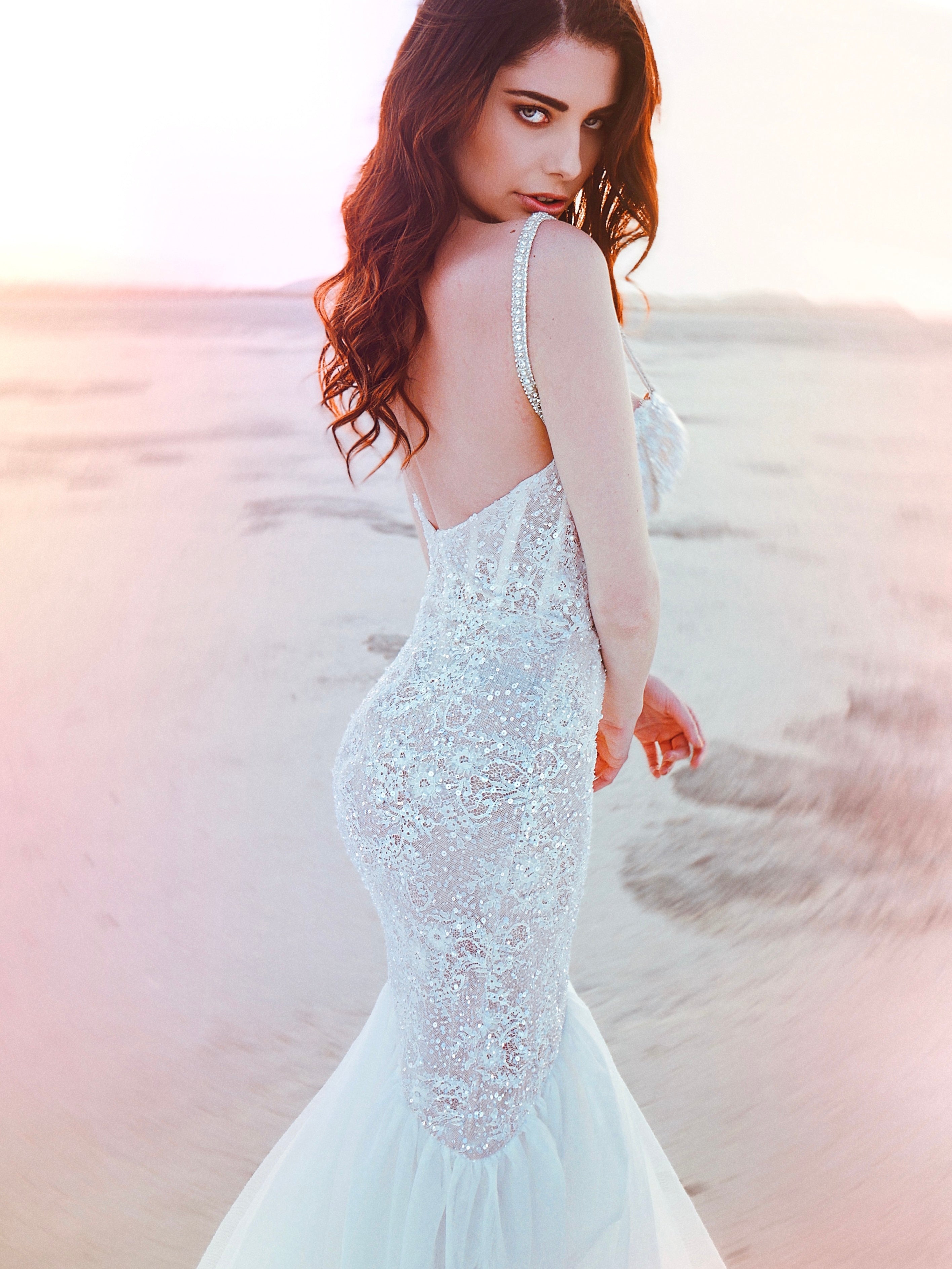 Over the shoulder shot of sexy wedding gown