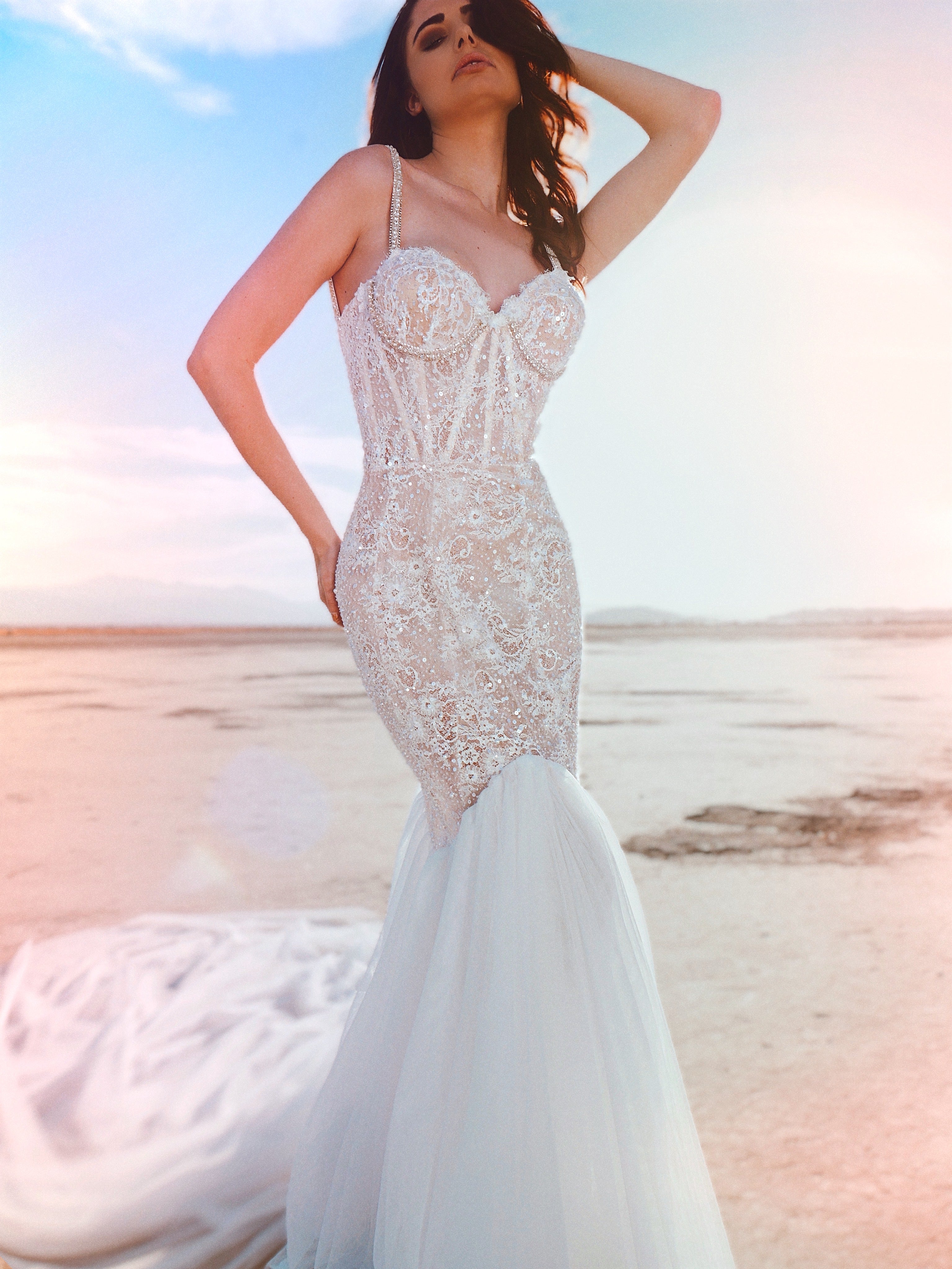 Visible boning wedding dress with model's hand on hips and head