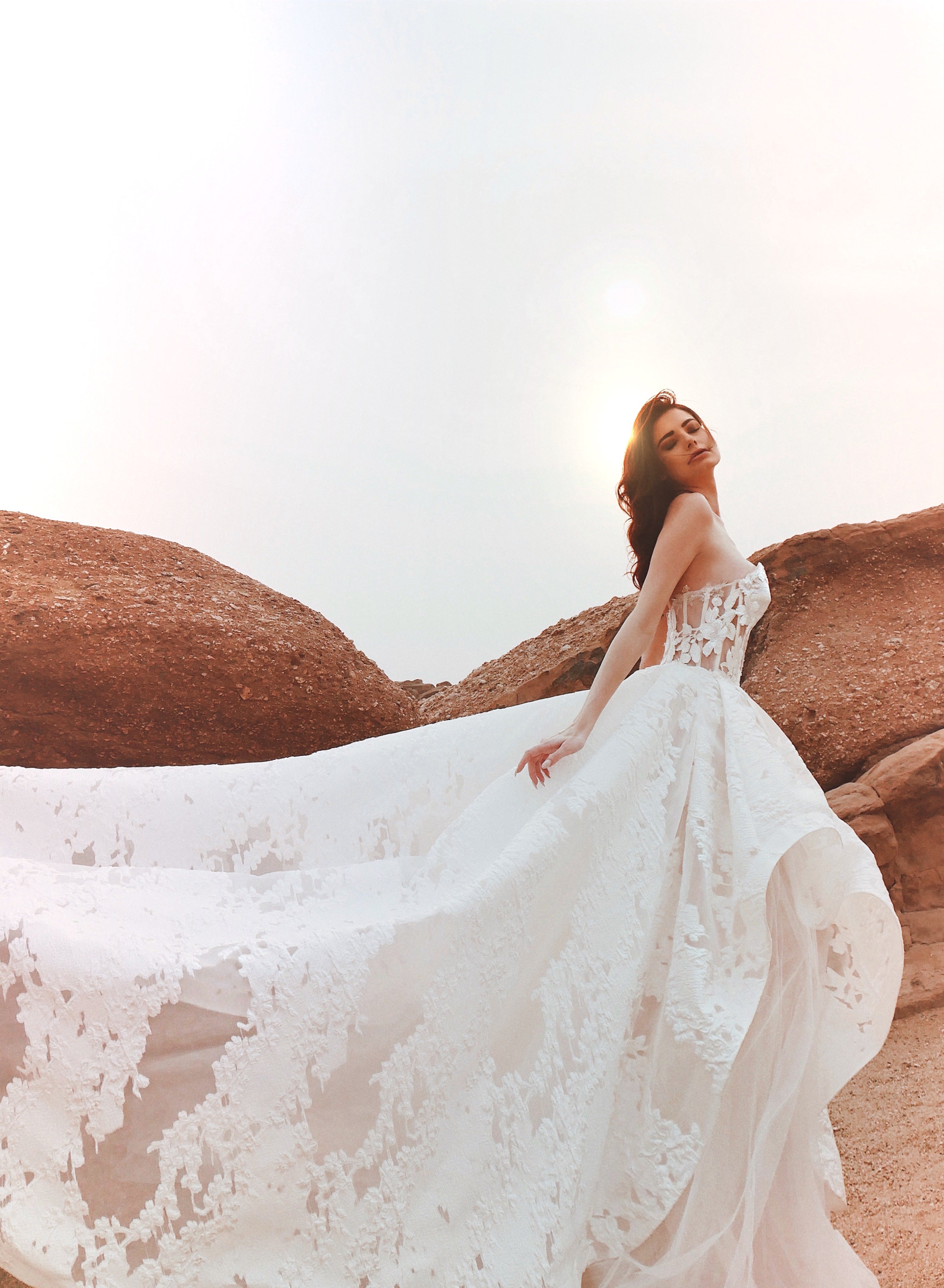 Side view of the Lauren Elaine Dove brocade floral organza corset wedding gown.