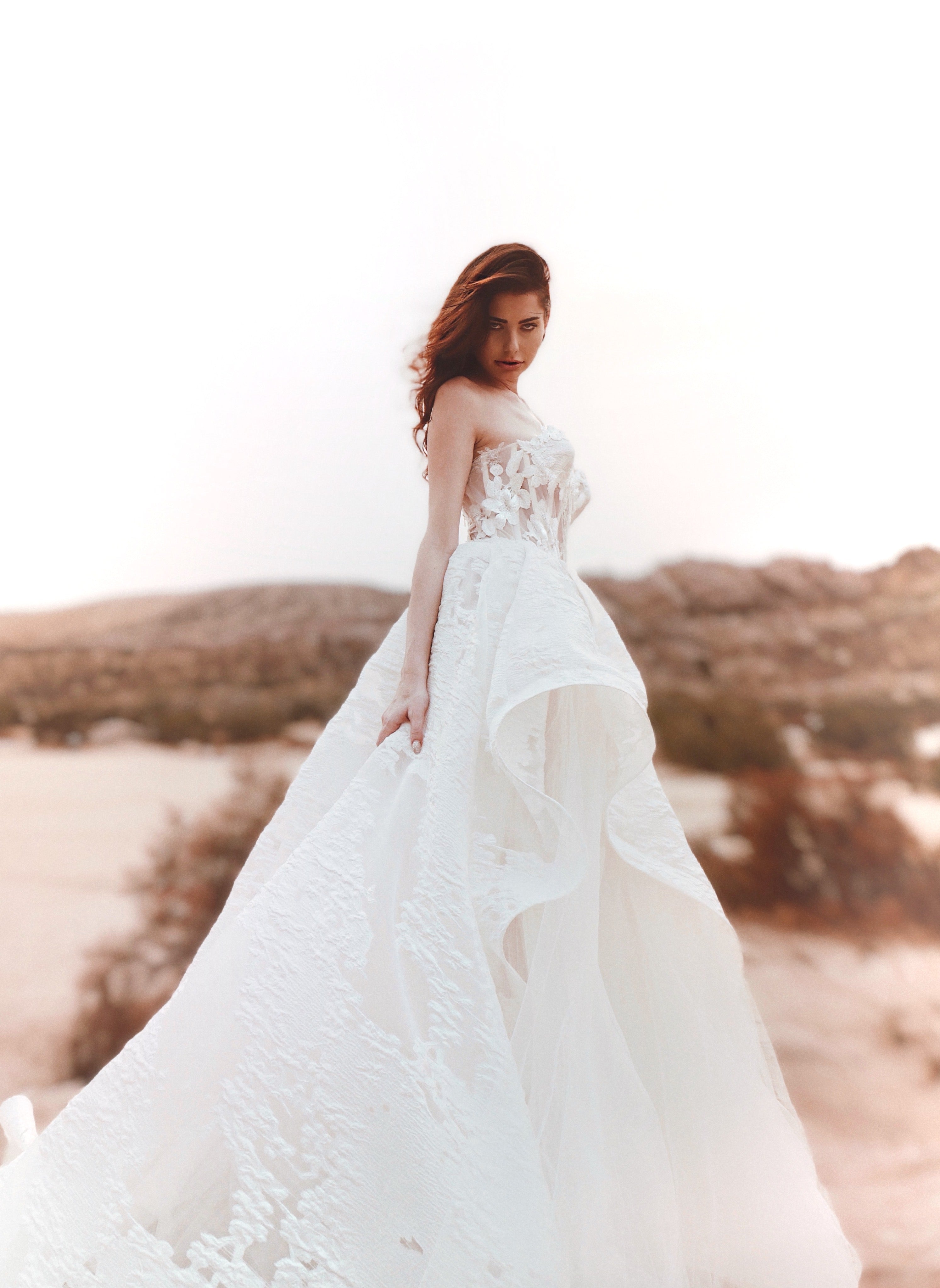 Angelic textured brocade floral organza corset wedding gown.