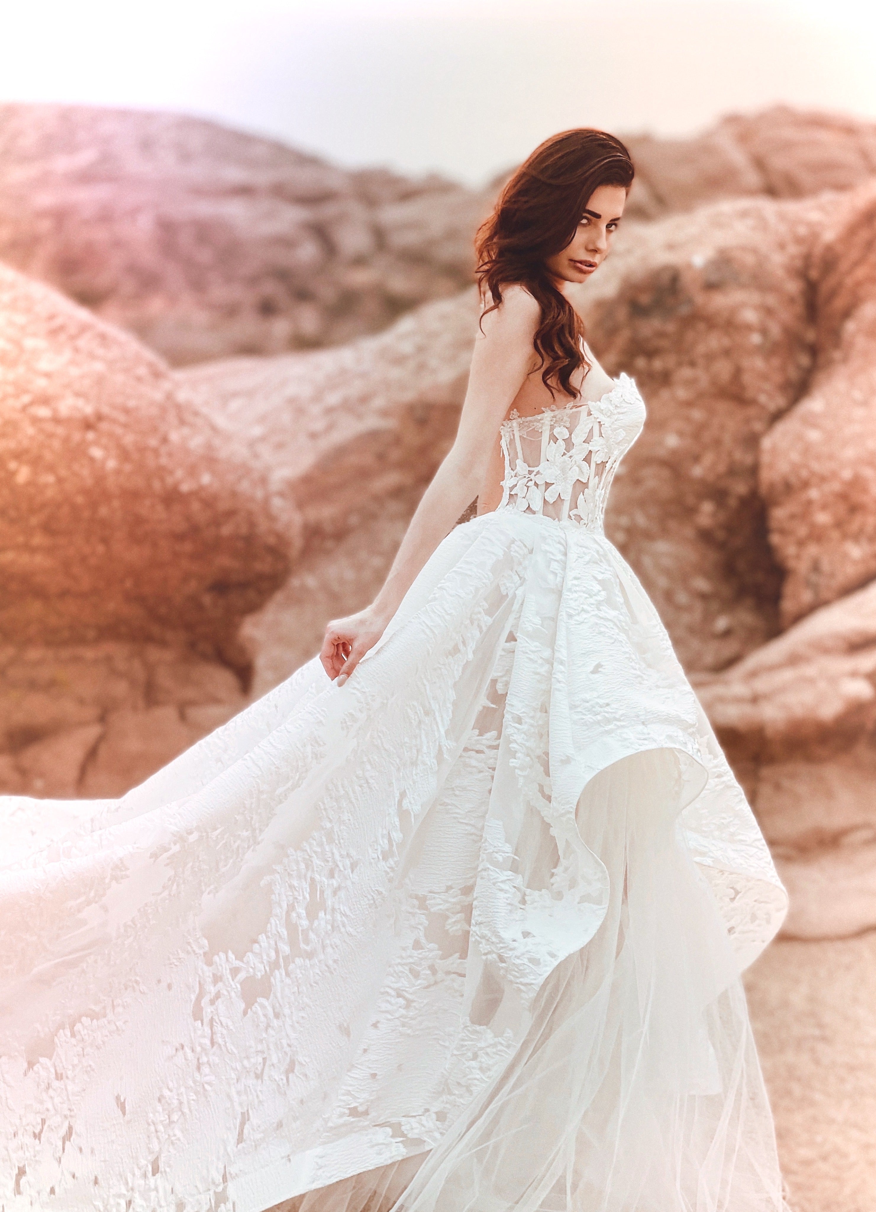 Tiered organza skirt wedding dress with corset bodice.