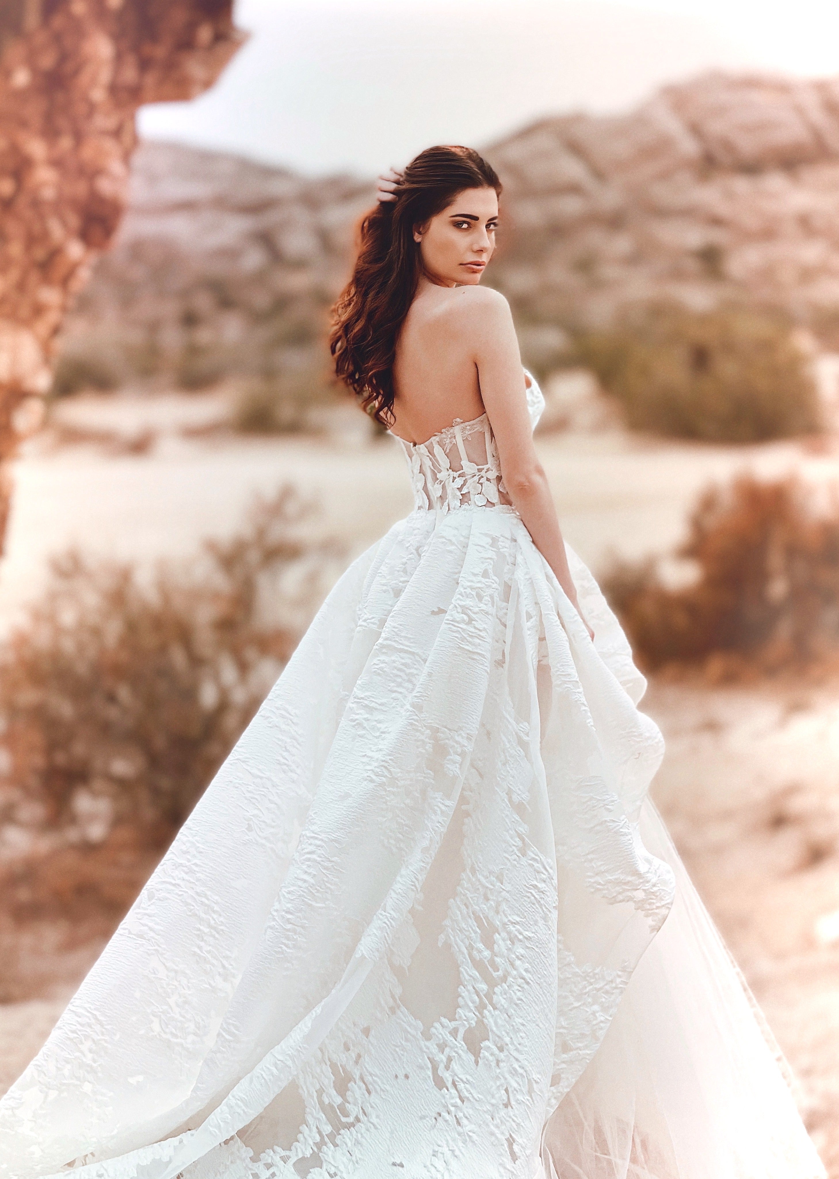 Back view of a strapless brocade floral organza corset wedding gown.