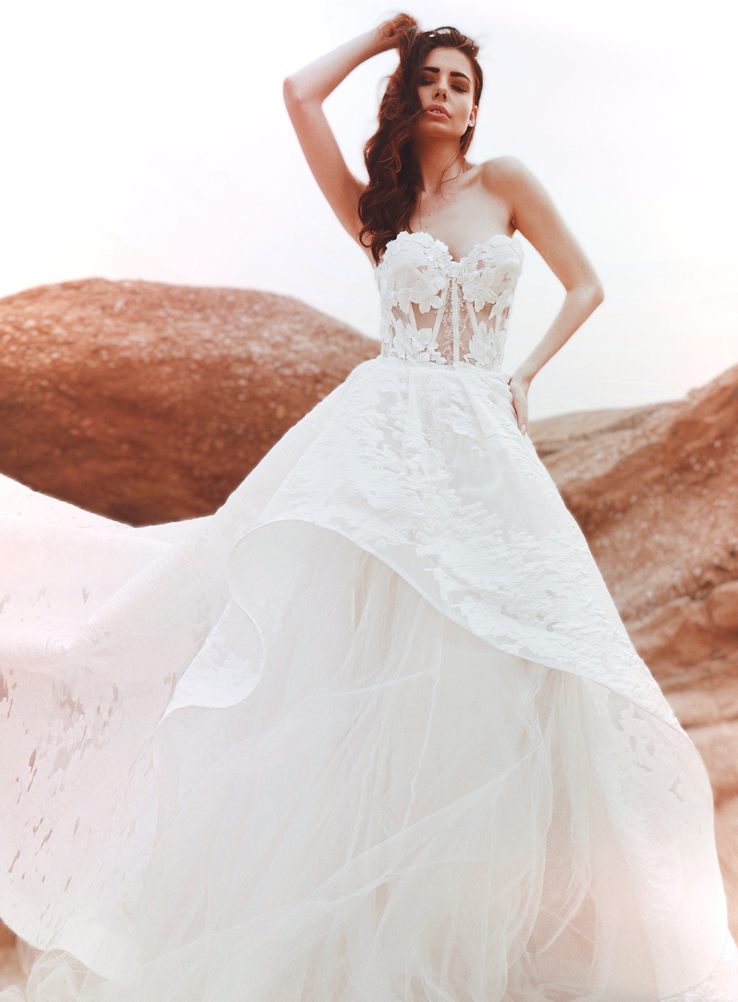 Tiered asymmetrical wedding dress with ball gown skirt by Lauren Elaine.