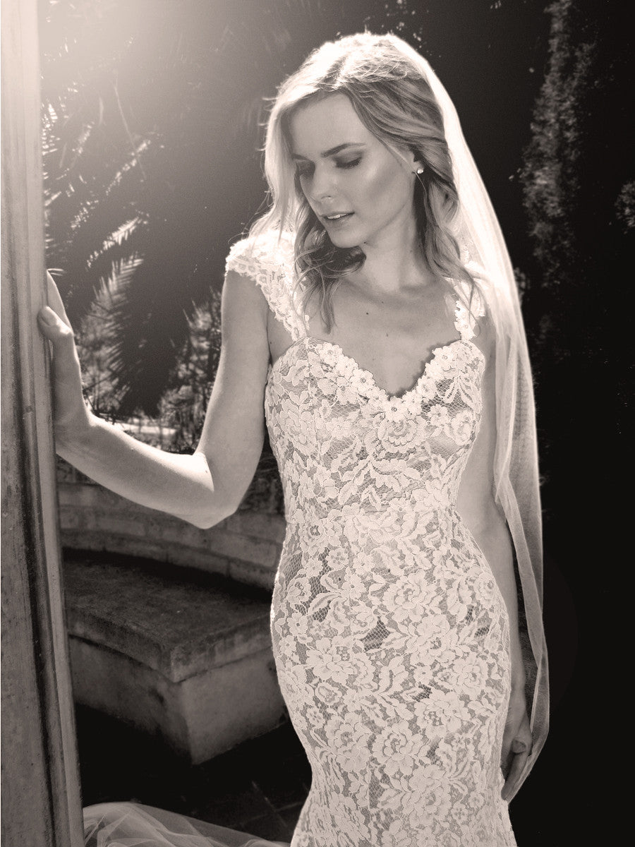 Capped sleeve sweetheart lace wedding gown with pearl and floral detailing