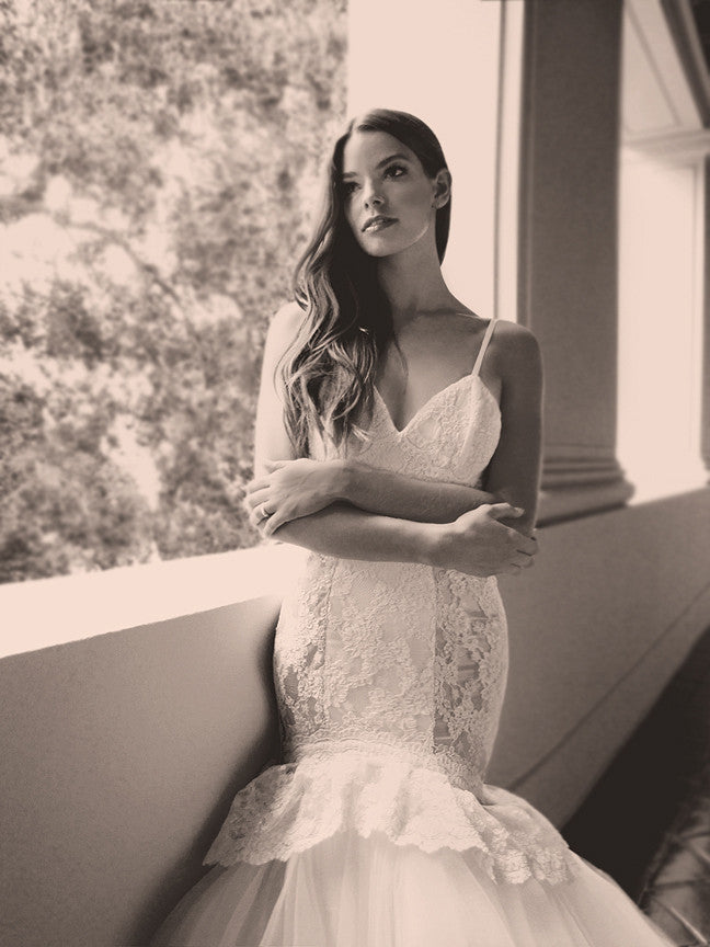 Lace peplum and illusion peek-a-boo mermaid wedding gown with bra cups and spaghetti straps