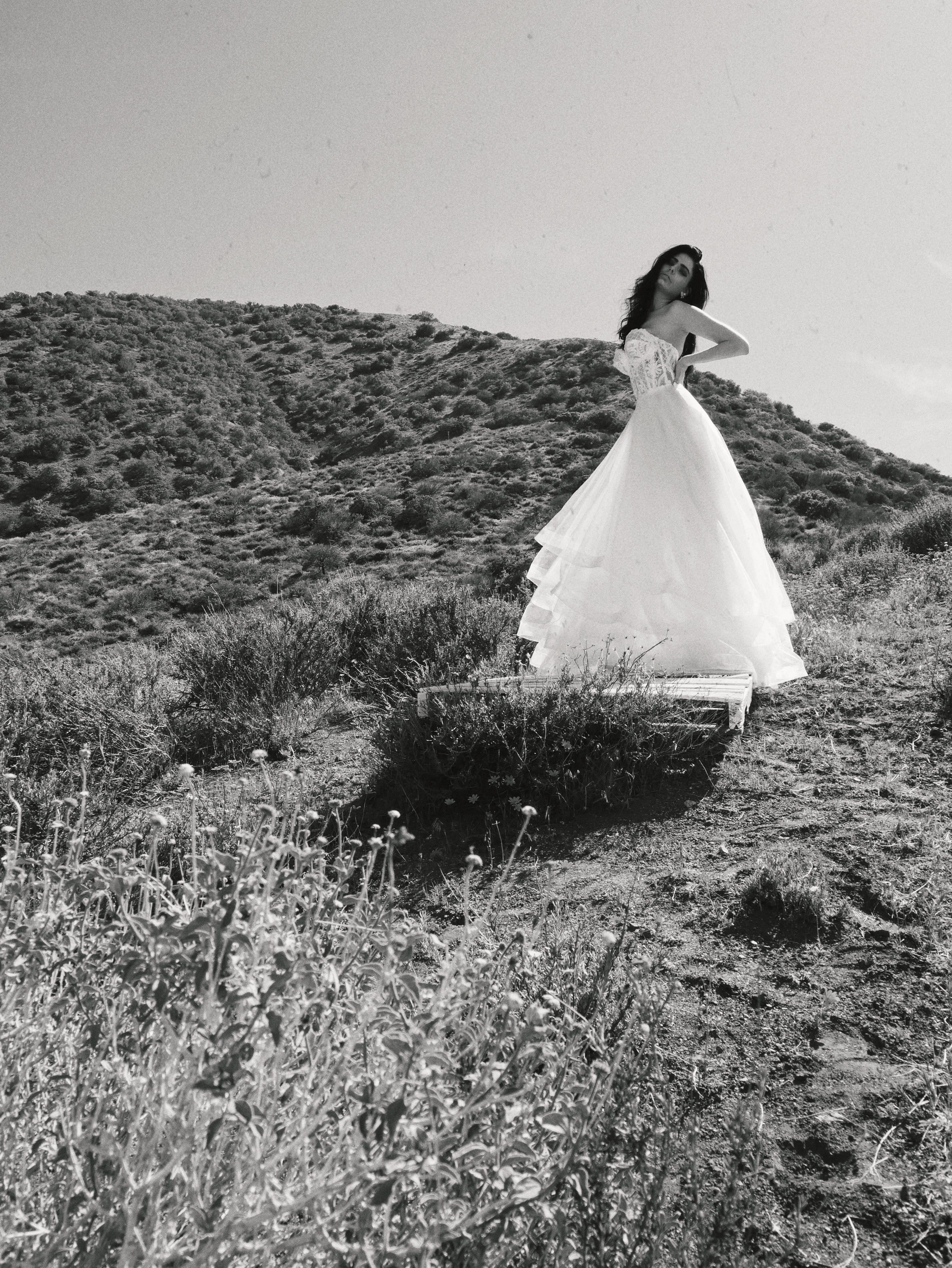 Black and white horsehair tulle wedding dress with sparkly top in countryside