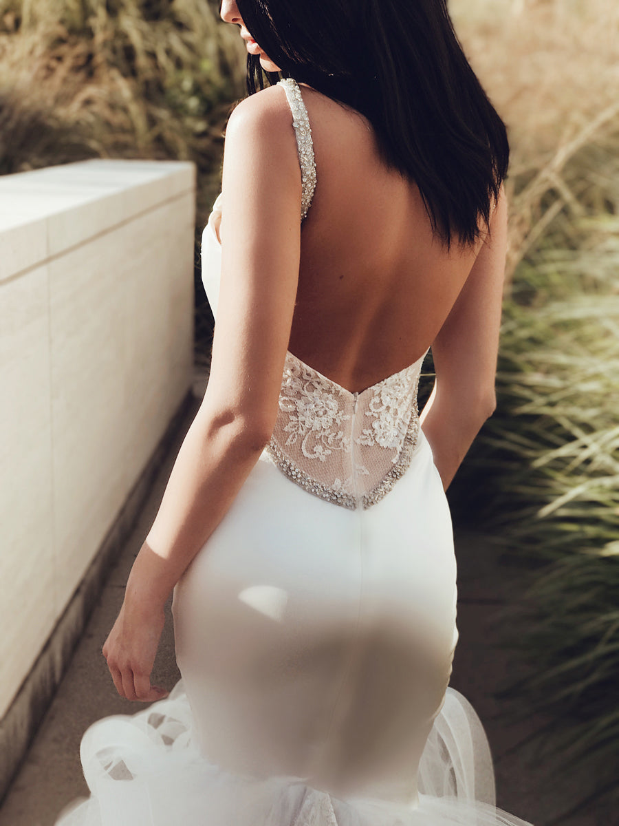 Closeup of back of satin lace mermaid wedding dress