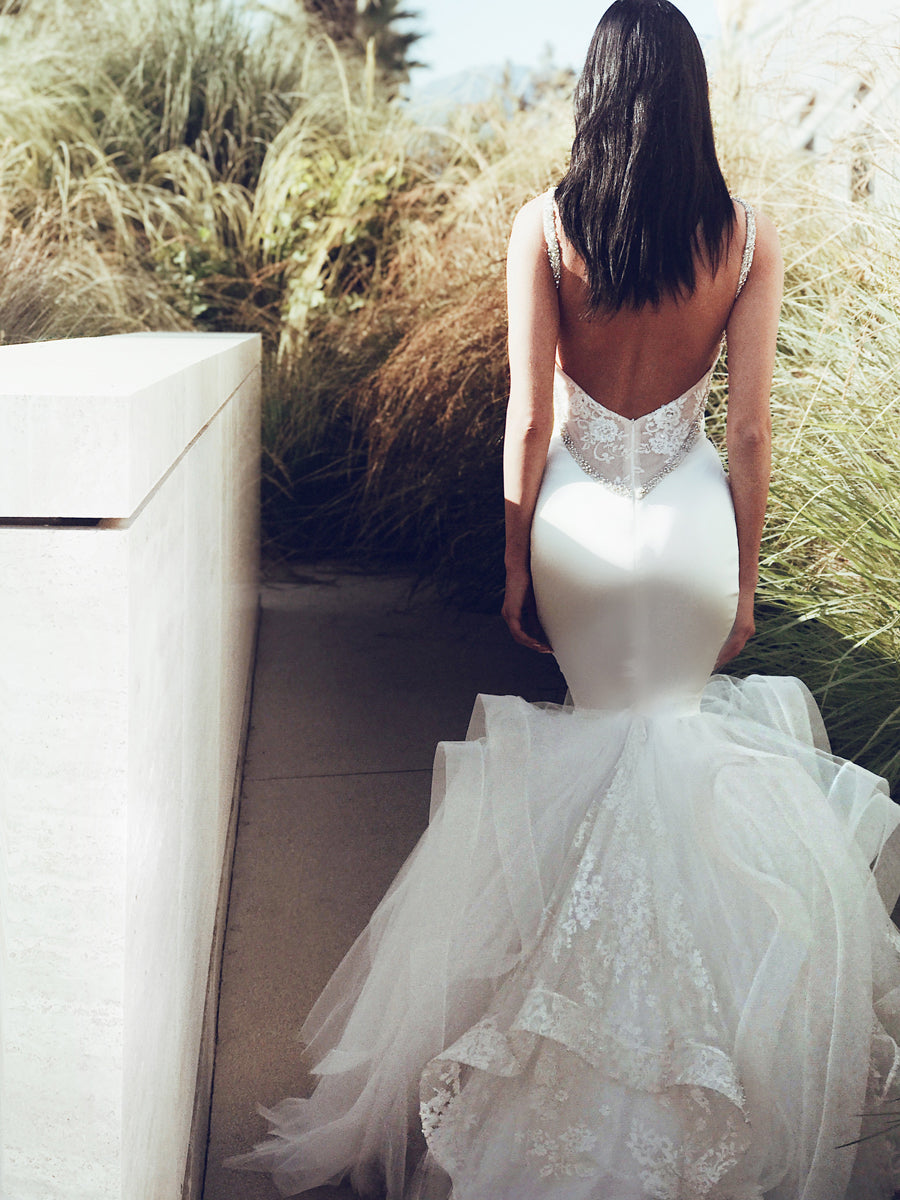 Back shot of satin wedding dress with lace back