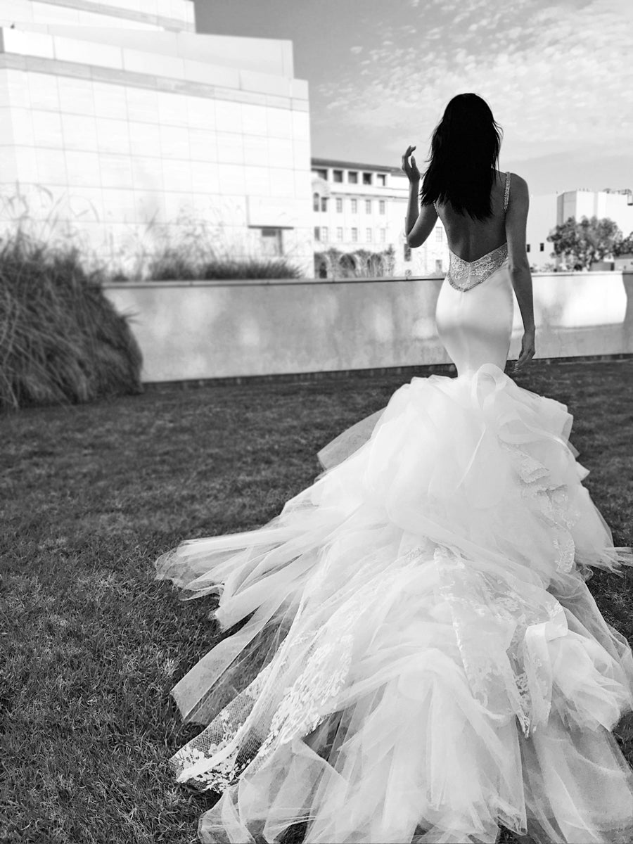 Satin wedding dress with long train and low back in black and white