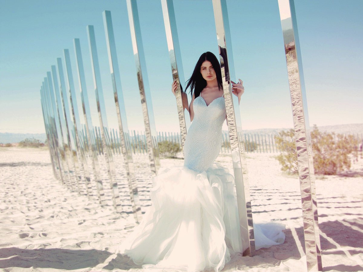 Lucite by Lauren Elaine is a sequin mermaid wedding dress with detachable cathedral train