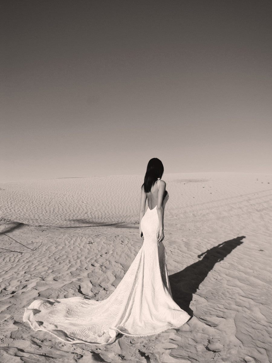 sexy backless sequin wedding dress with cathedral train and spaghetti straps