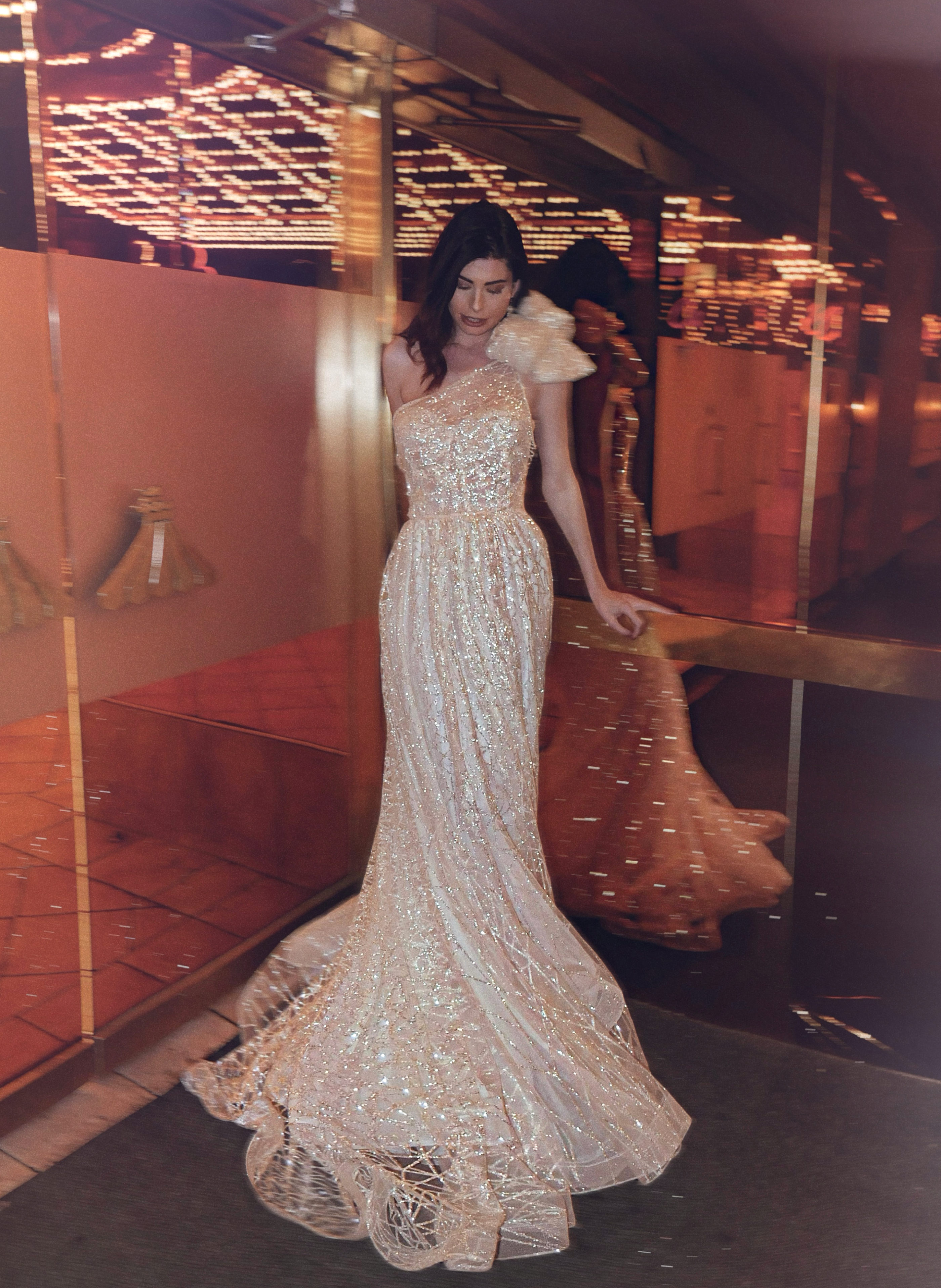 one shoulder corset sparkle A-line wedding dress by Lauren elaine bridal with shoulder bow