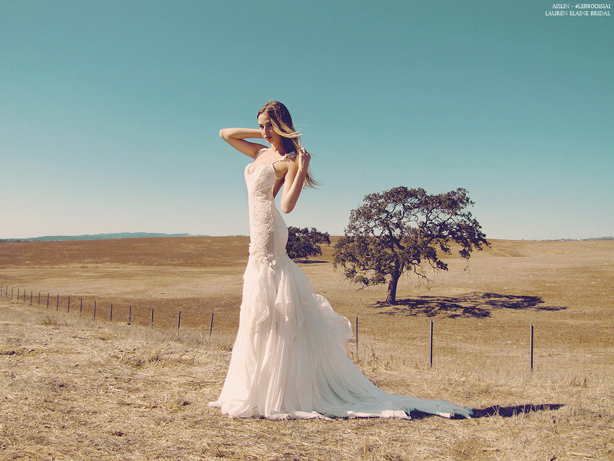 Mermaid chiffon and lace wedding gown with open back.