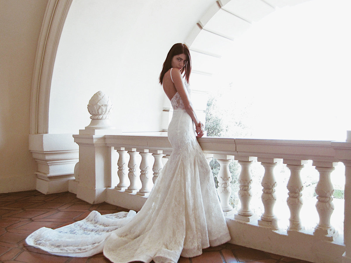 Sexy vintage feel "Ember" wedding gown by Lauren Elaine Bridal with illusion back and naked mesh underlay with sweetheart bodice appliqués.