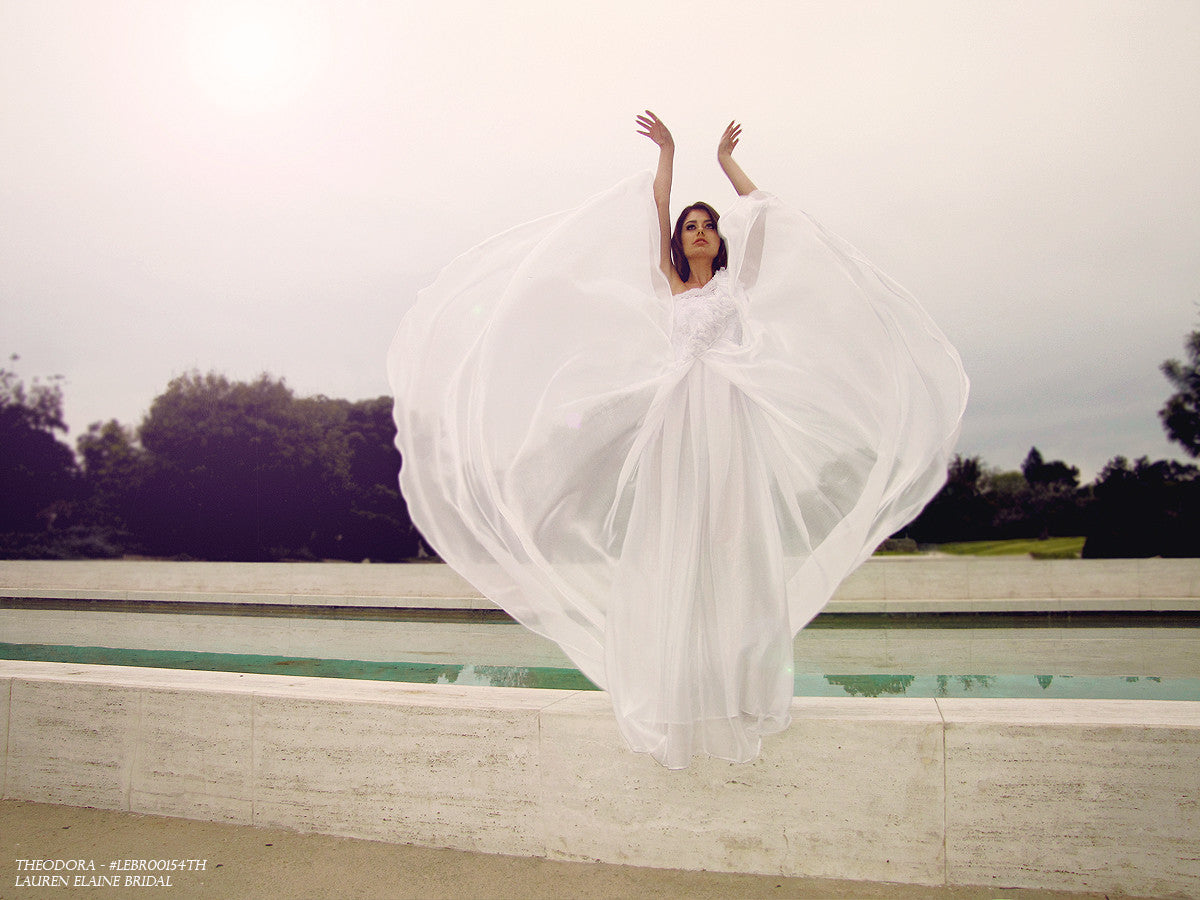 Ethereal wedding gowns by Lauren Elaine Bridal. A-line chiffon gown with ruffles & illusion lace.