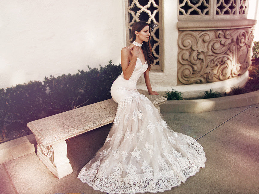 Sexy trumpet wedding gown with blush underlay and dramatic open back with spaghetti straps. Vaile by Lauren Elaine.