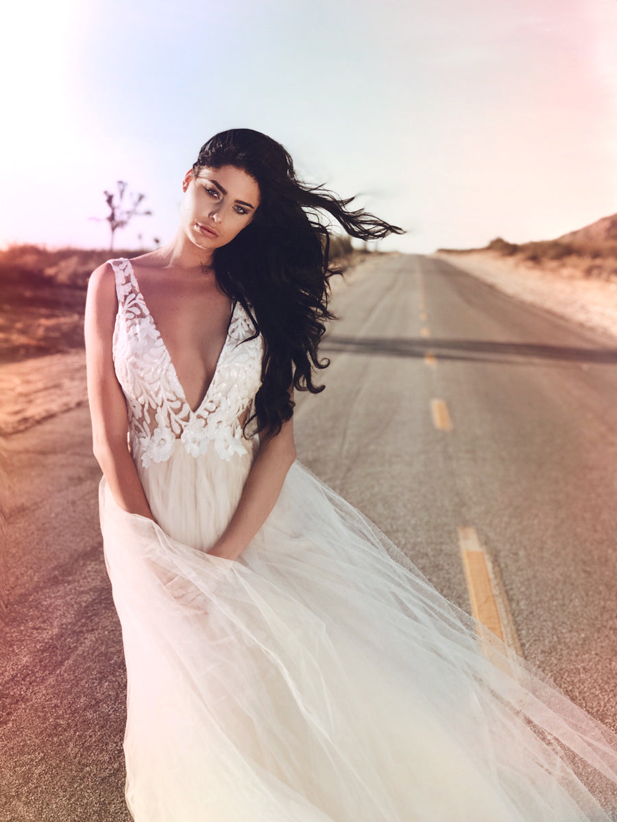 Plunging v-neck sequin and tulle ball gown with cathedral train from Lauren Elaine Bridal