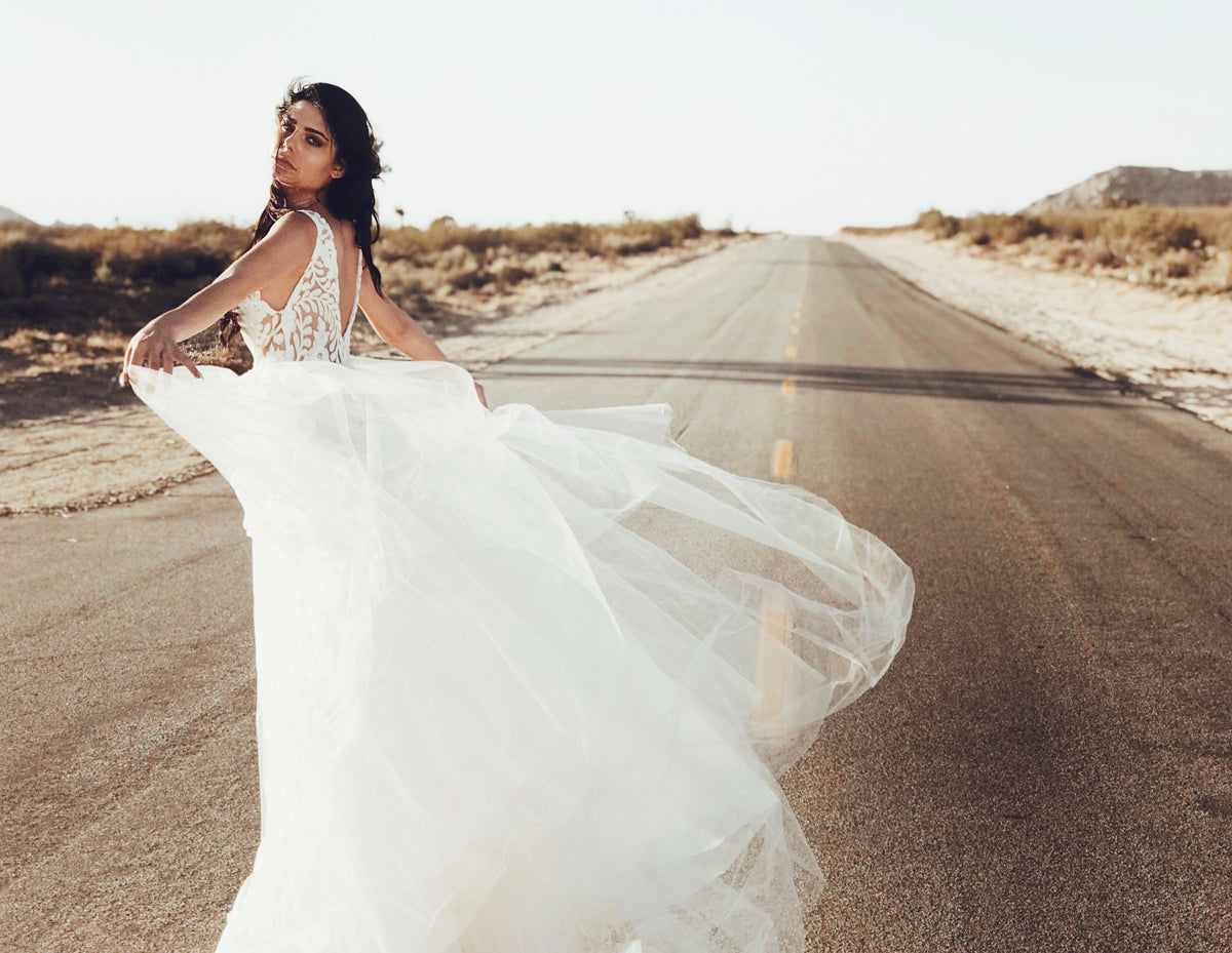 Lauren Elaine Bridal "Isadora" wedding gown with v-neck and sequin detailing