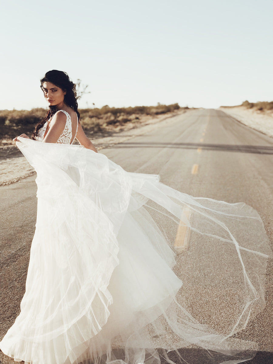 Lauren Elaine Bridal "Isadora" wedding gown with v-neck illusion and tulle skirt with cathedral train