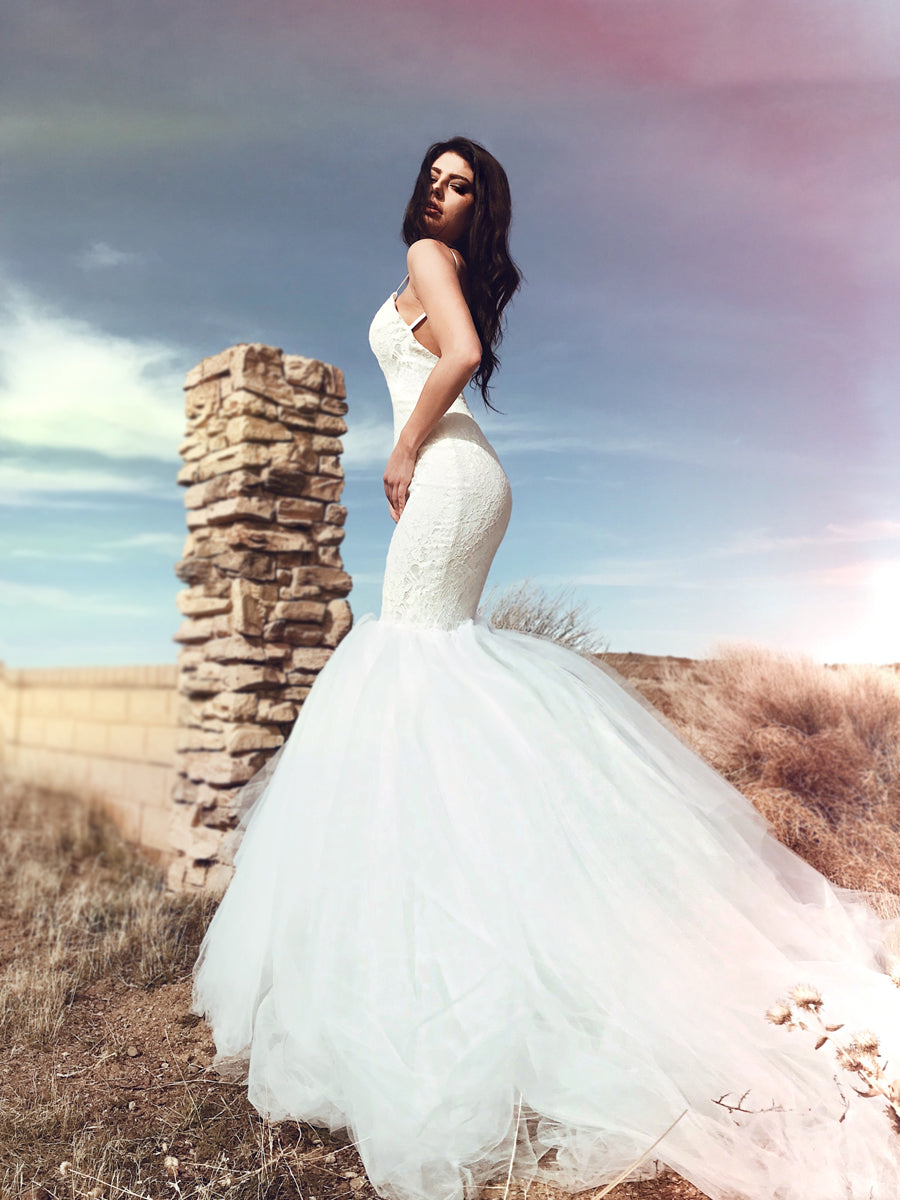Backless sparkle lace mermaid wedding dress with 6ft cathedral train and satin spaghetti straps. Lola from the Pearl by Lauren Elaine Bridal Collection.