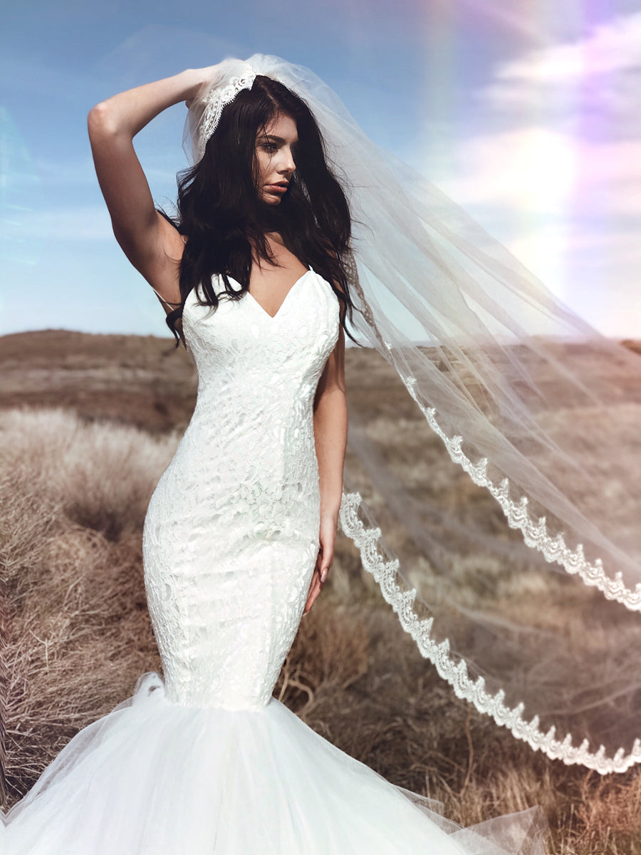 Sweetheart mermaid wedding dress with sparkling lace and glamorous tulle skirt. Affordable couture wedding gowns by Lauren Elaine.