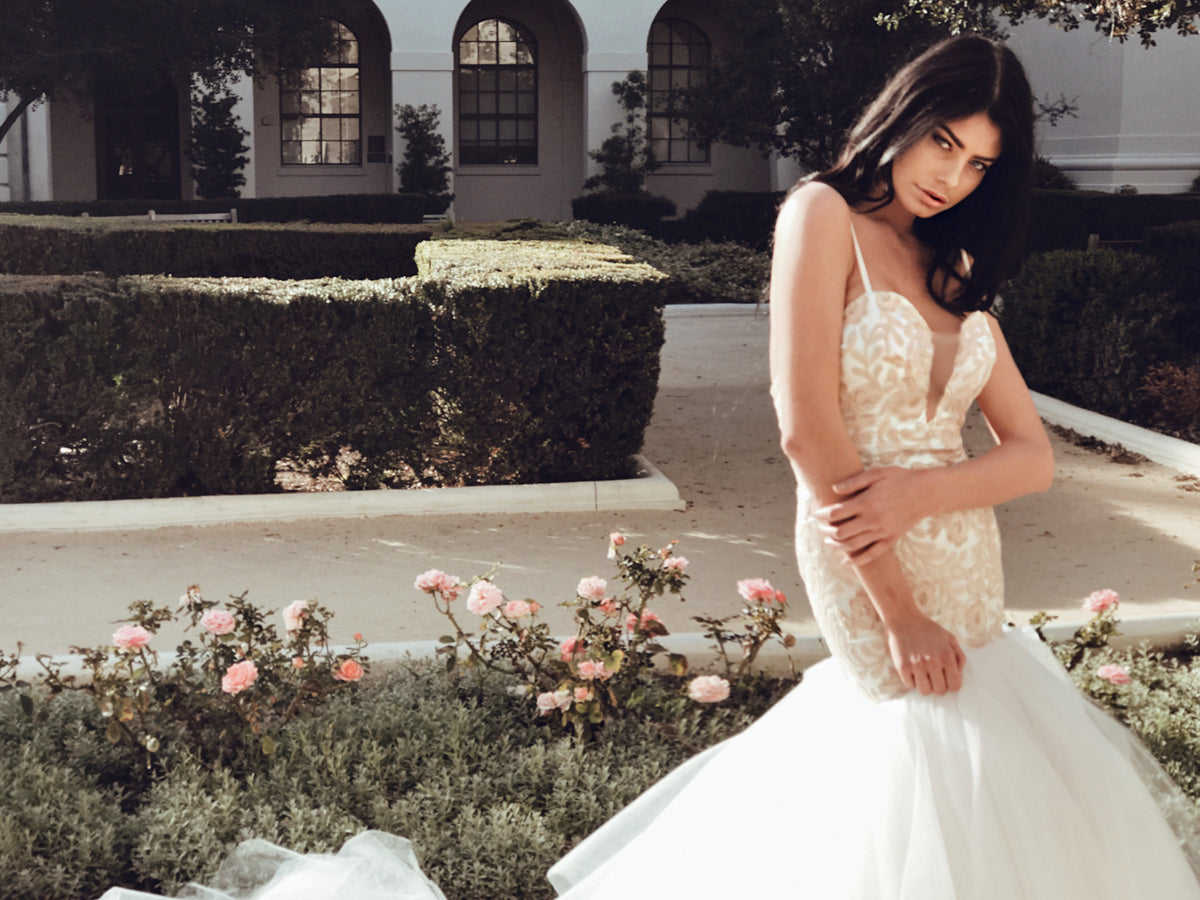 Sequin blush mermaid wedding dress with deep v illusion neckline and 8ft cathedral train