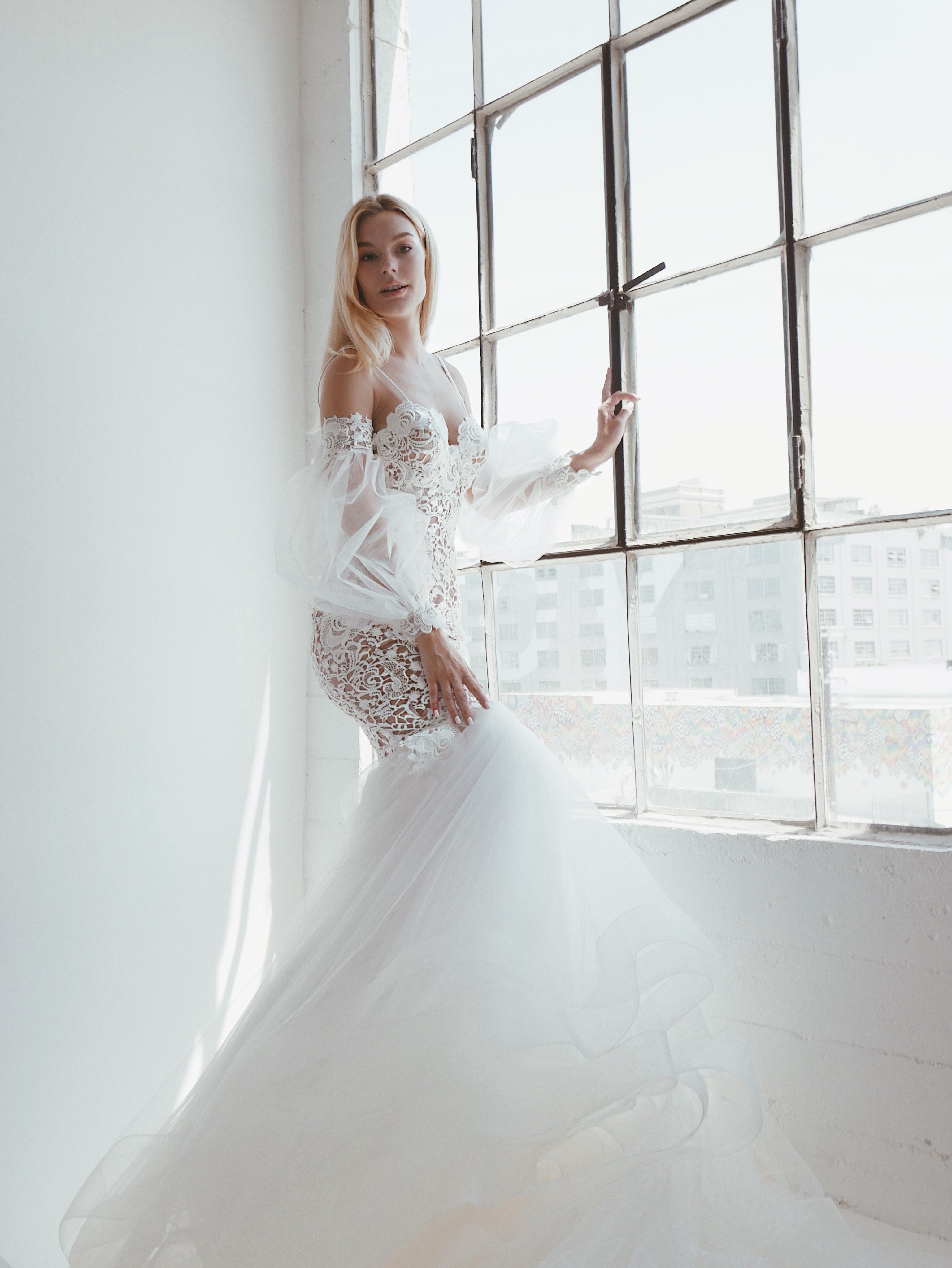 Arcadia by Lauren Elaine Bridal guipure lace mermaid wedding dress with removable bishop sleeves 