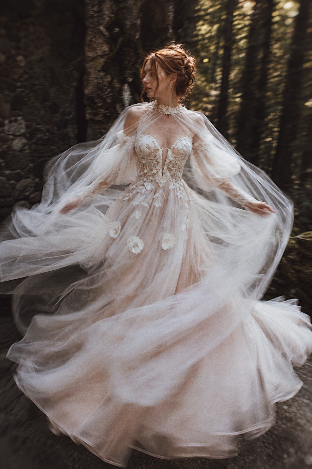 Arrowyn romantic wedding dress with botanical appliqué and ethereal tulle cape.