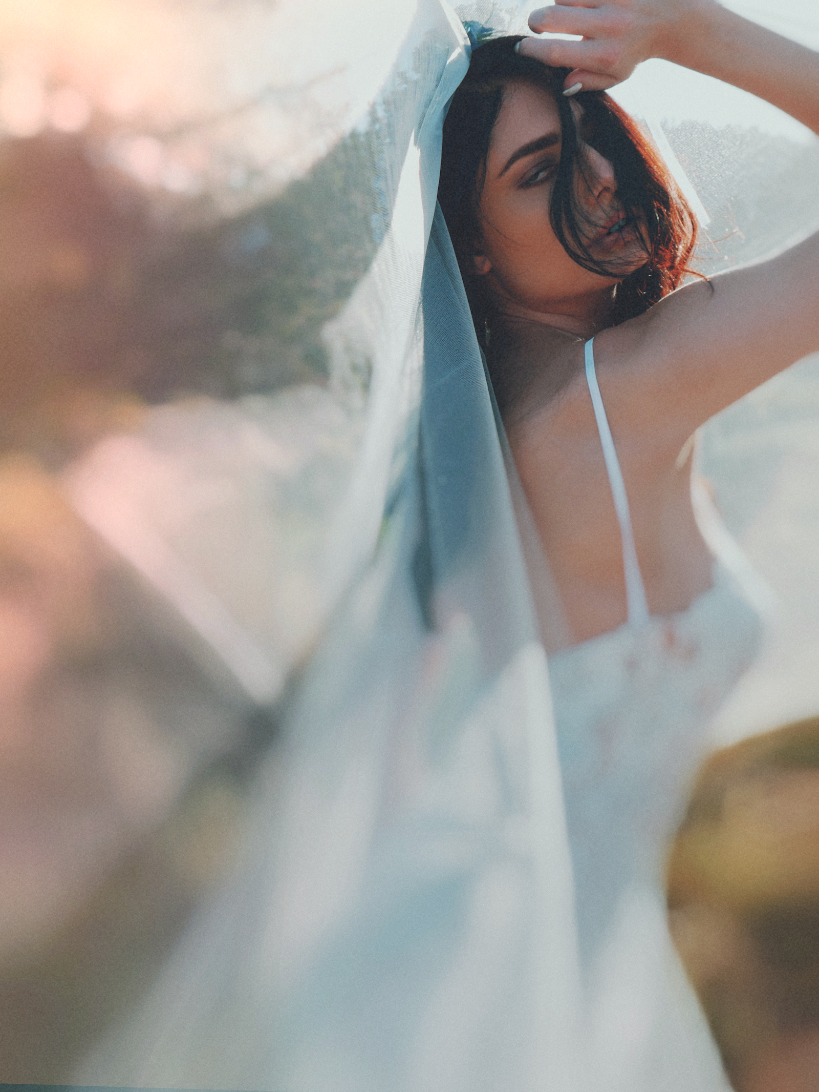 An editorial fashion campaign featuring a tulle blusher style wedding veil