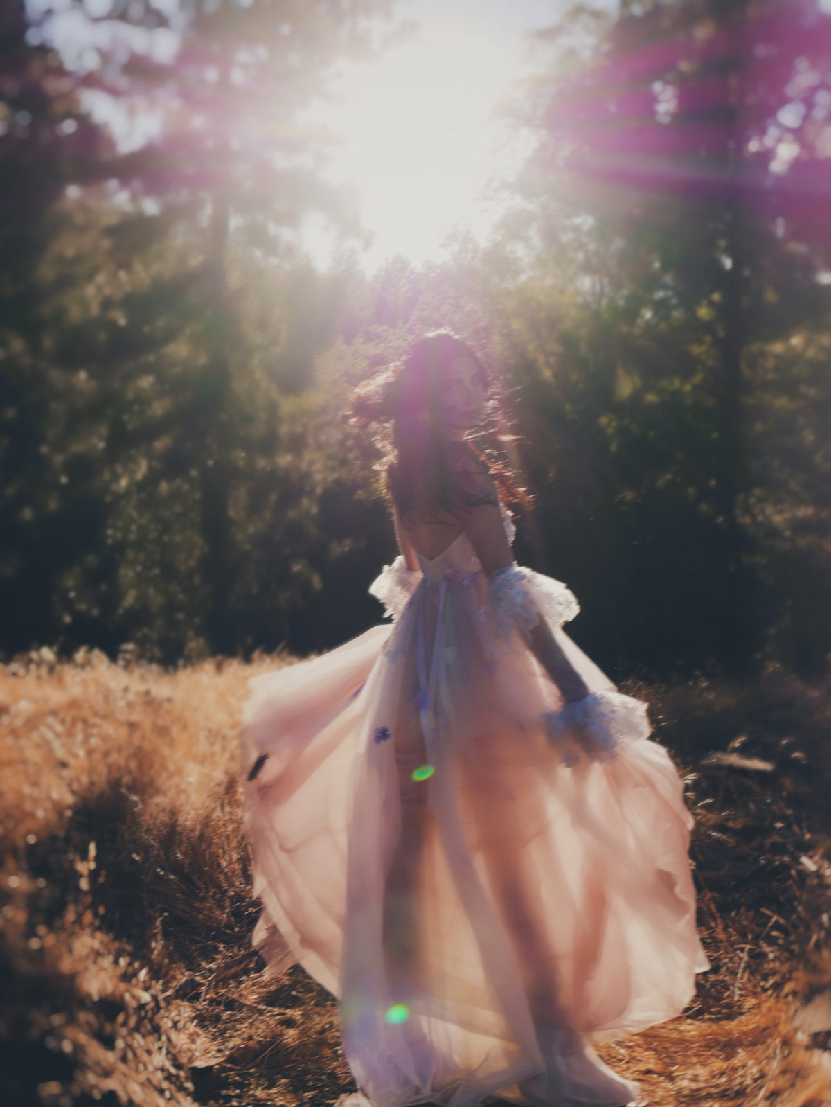Florêve ethereal floral wedding dress in blush tulle with colorful 3D wildflower appliqués in motion