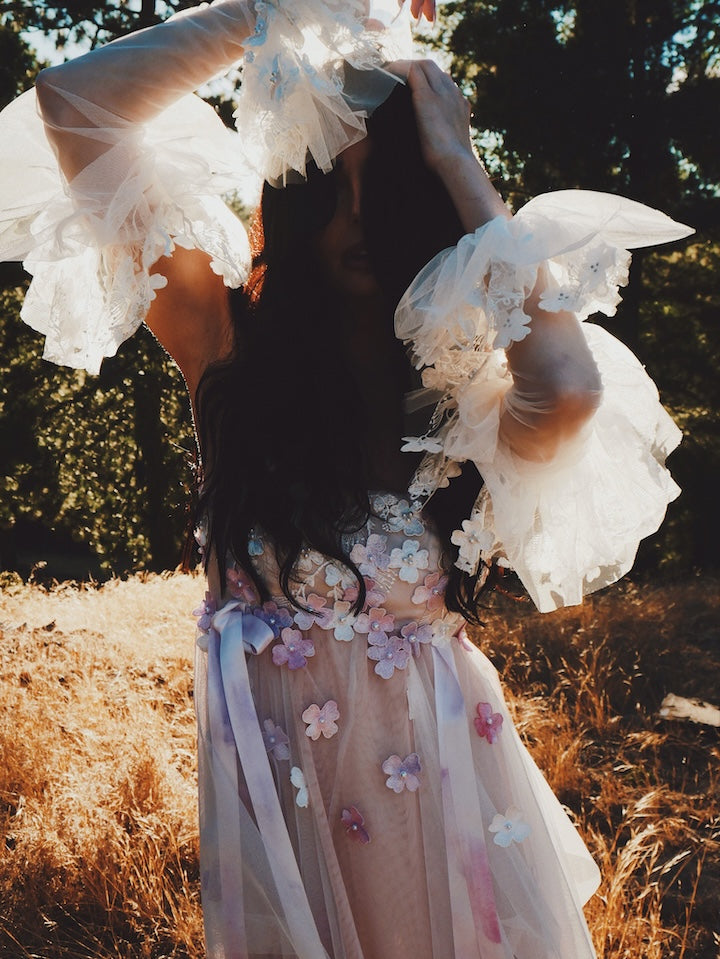 Florêve colorful wildflower wedding dress with pink and lavender 3D floral appliqués and sheer statement sleeves