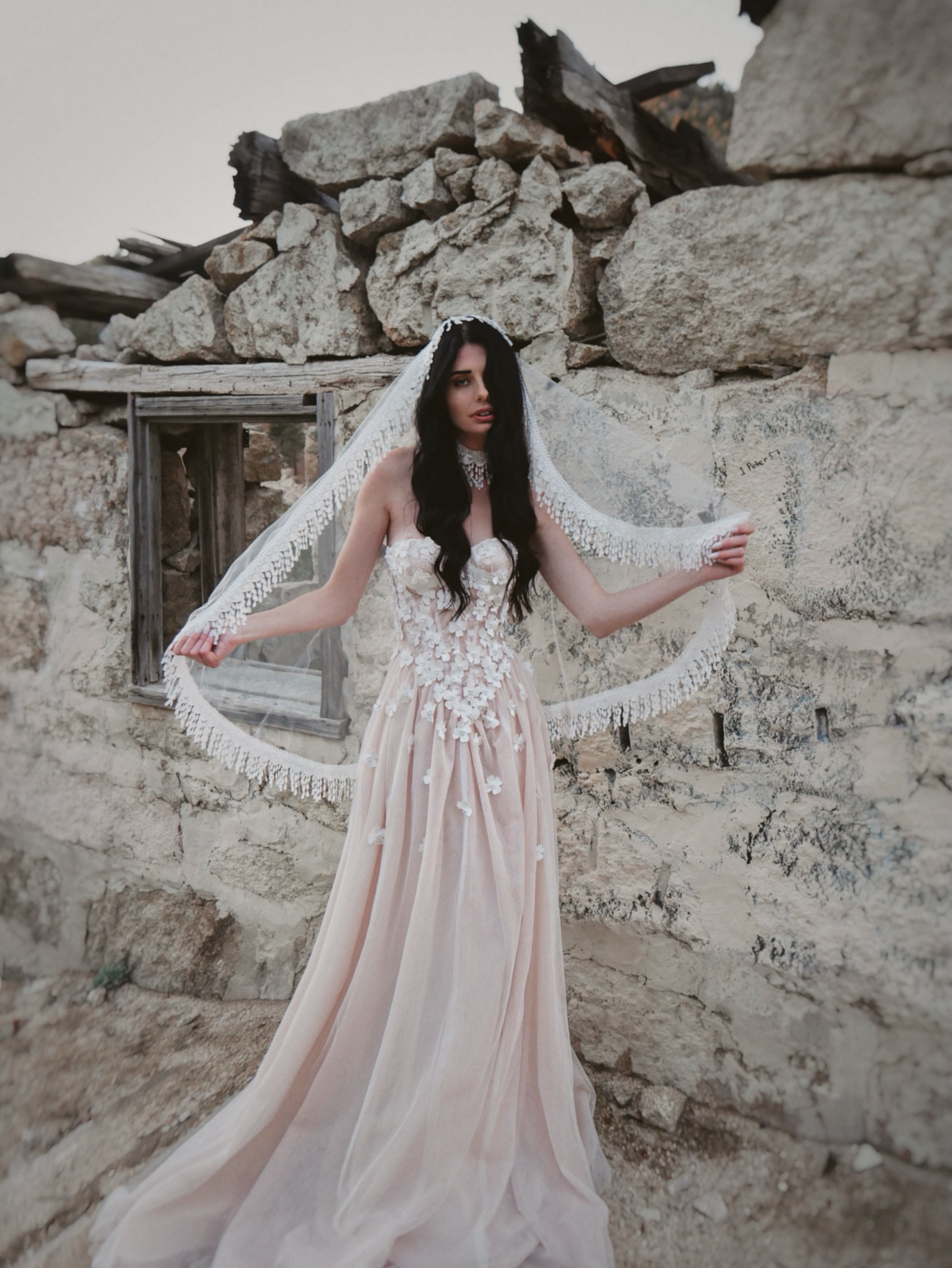 Boho chic wedding veil with crochet fringe draped in mantilla style