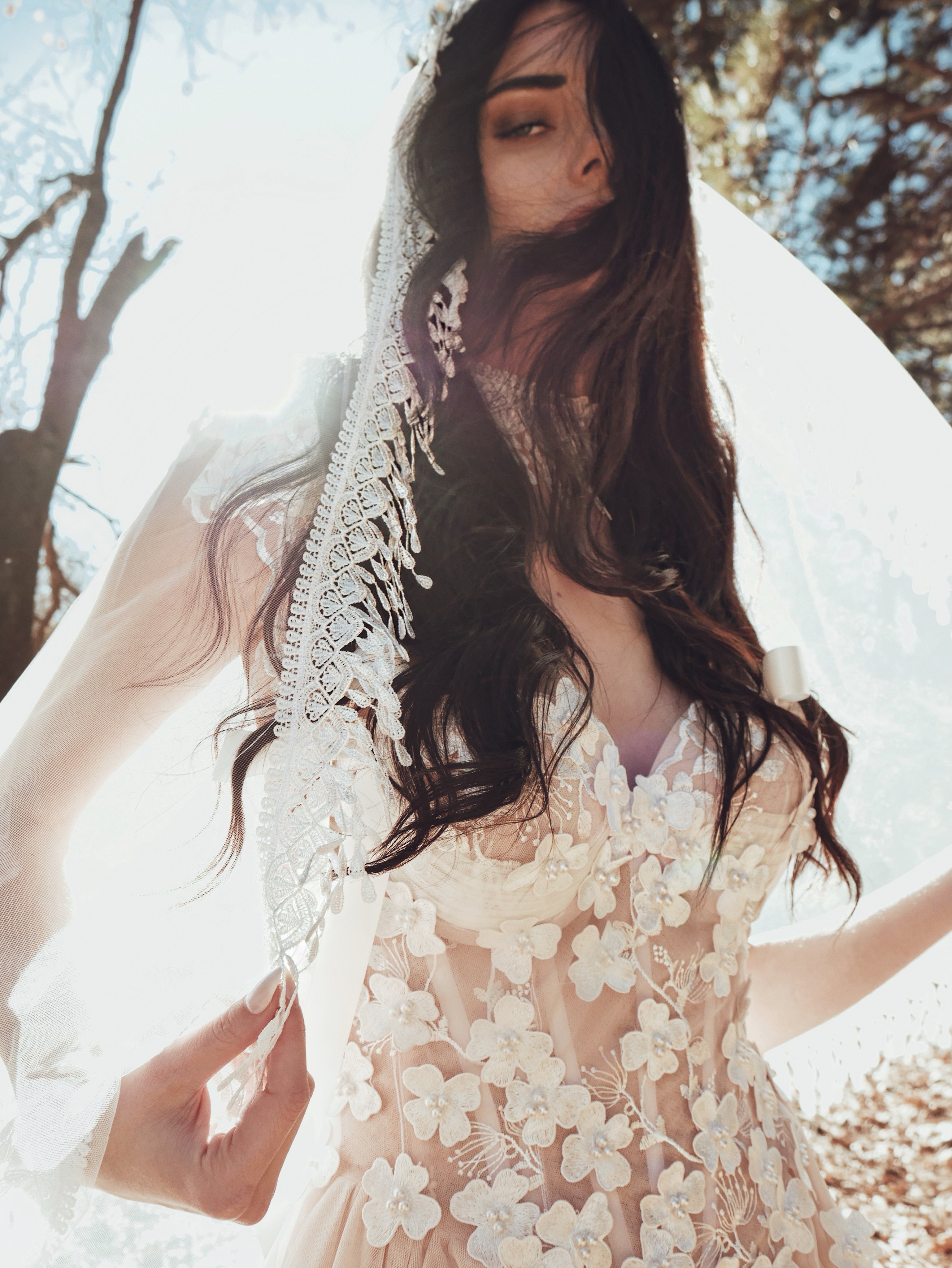 Crochet lace fringe detail on boho wedding veil by Lauren Elaine Bridal, showcasing handcrafted edging and airy tulle