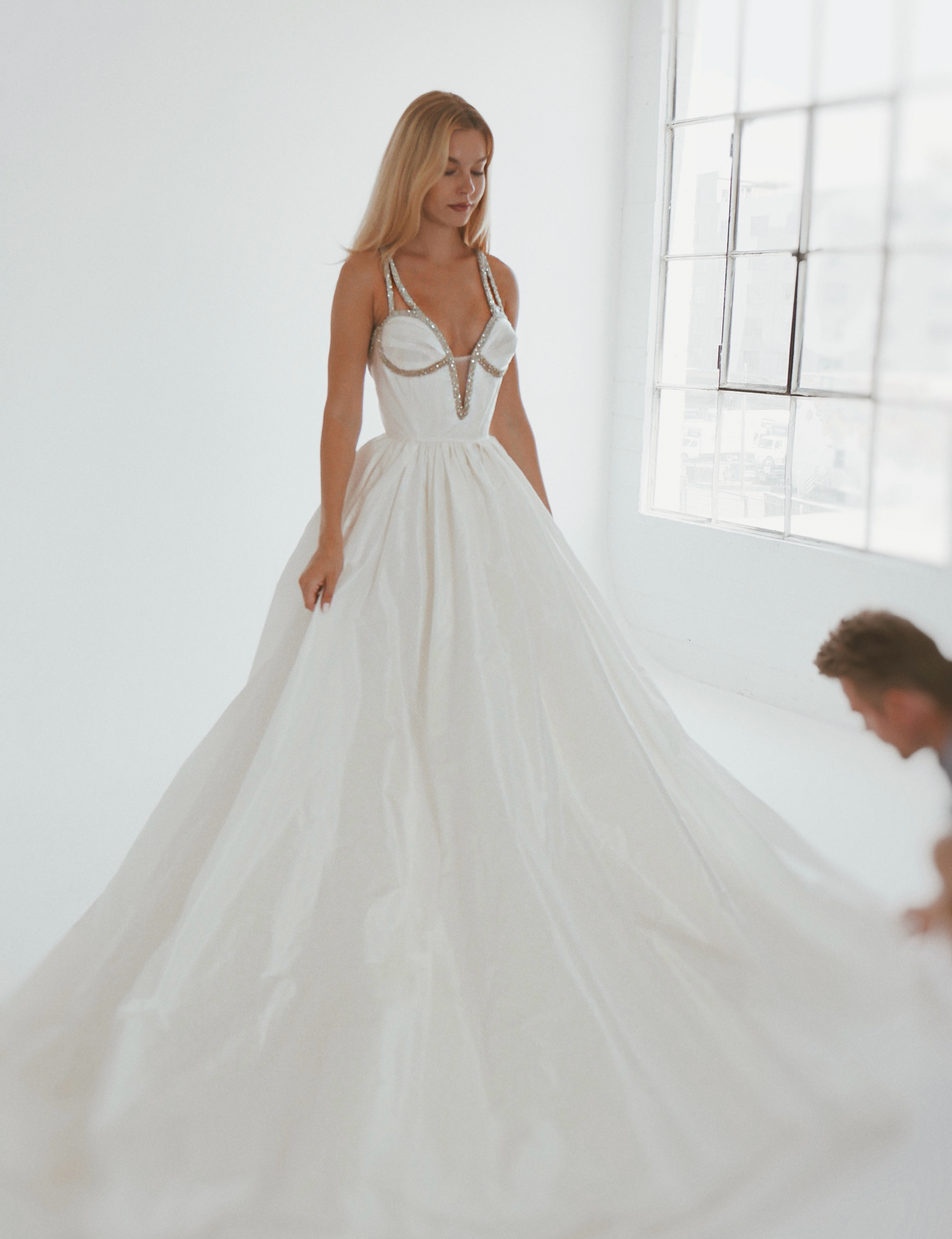 Crystal strap ball gown in a bright Los Angeles bridal studio during a Luxe private wedding dress appointment.
