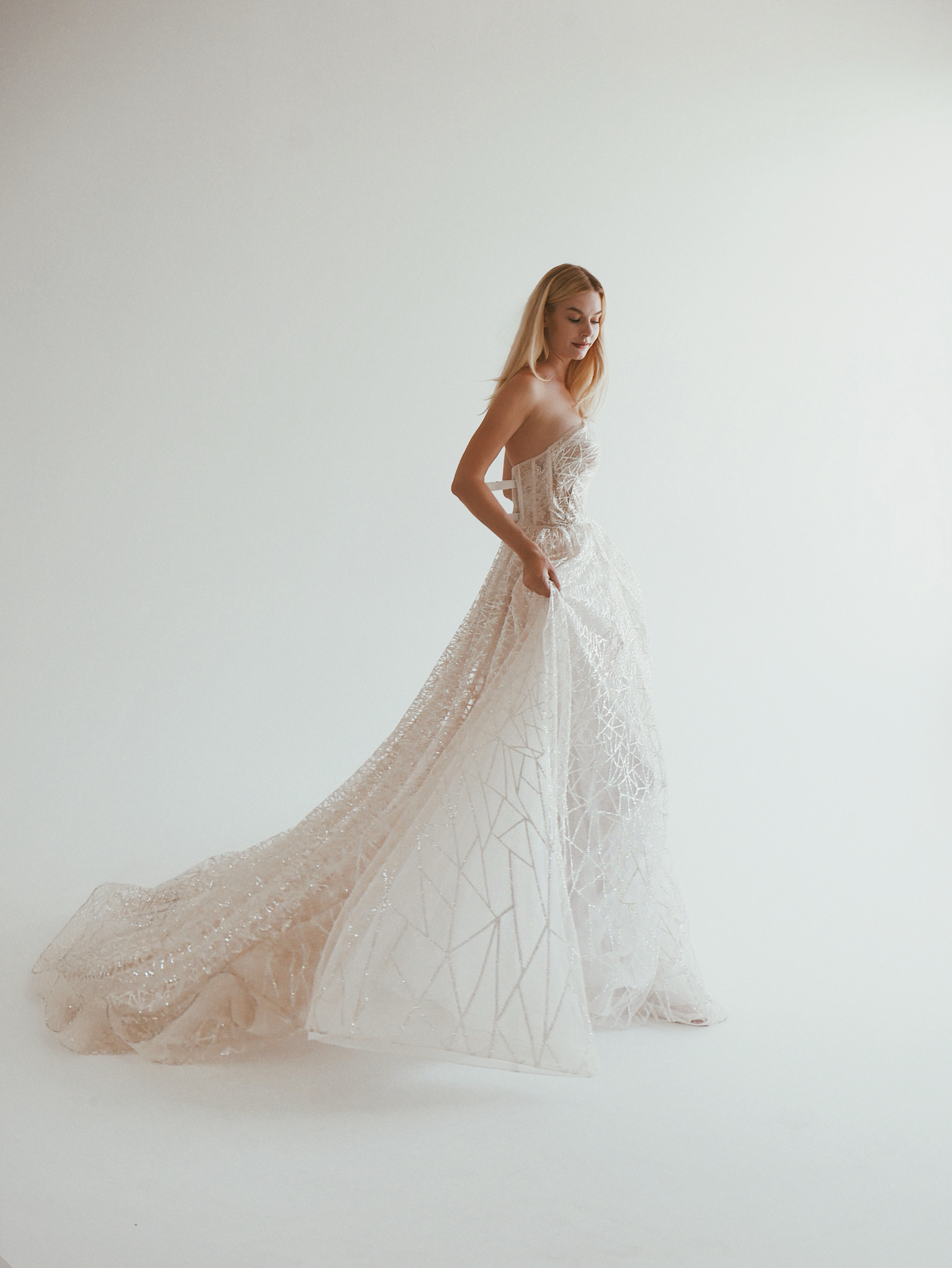 Editorial mermaid wedding gown with geometric lace photographed in Los Angeles during a Luxe bridal appointment.