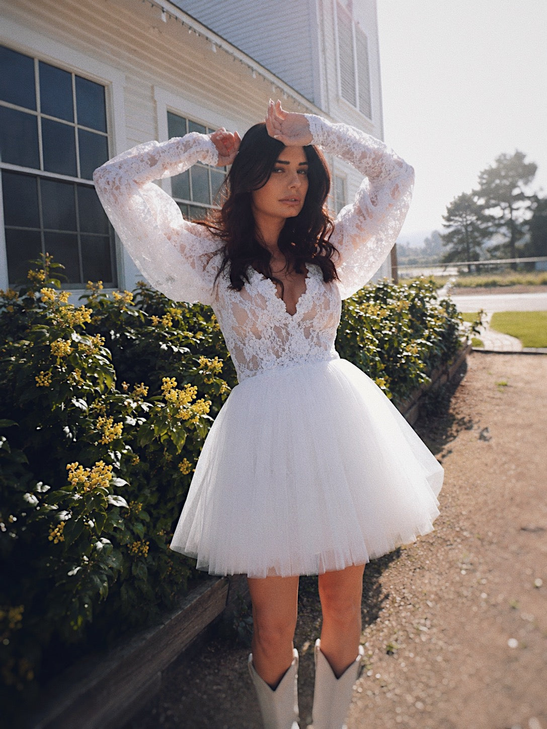 Vintage lace mini wedding dress with deep V neckline and gigot sleeves by Lauren Elaine