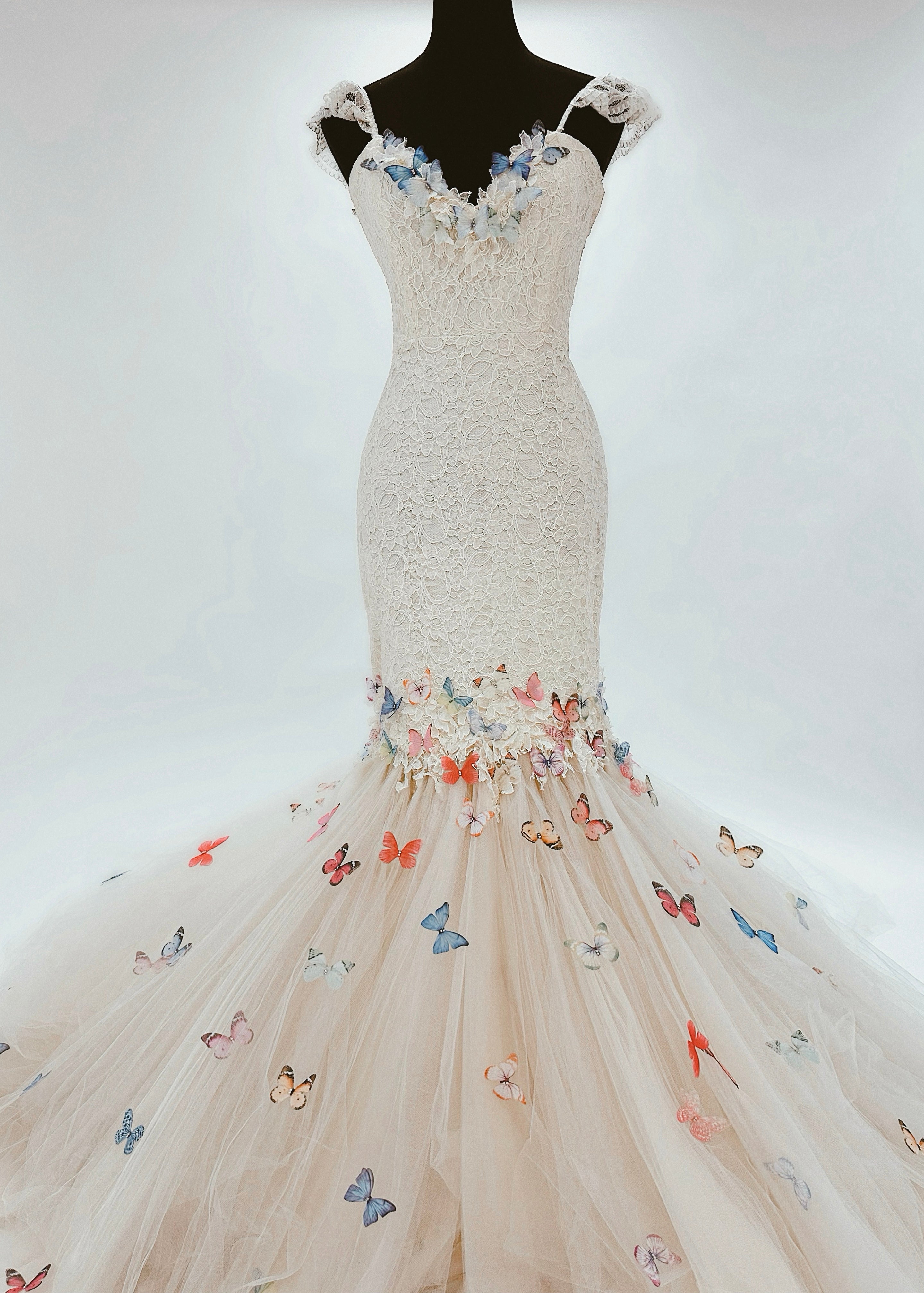Colorful rainbow butterfly wedding dress with dramatic tulle skirt and train 