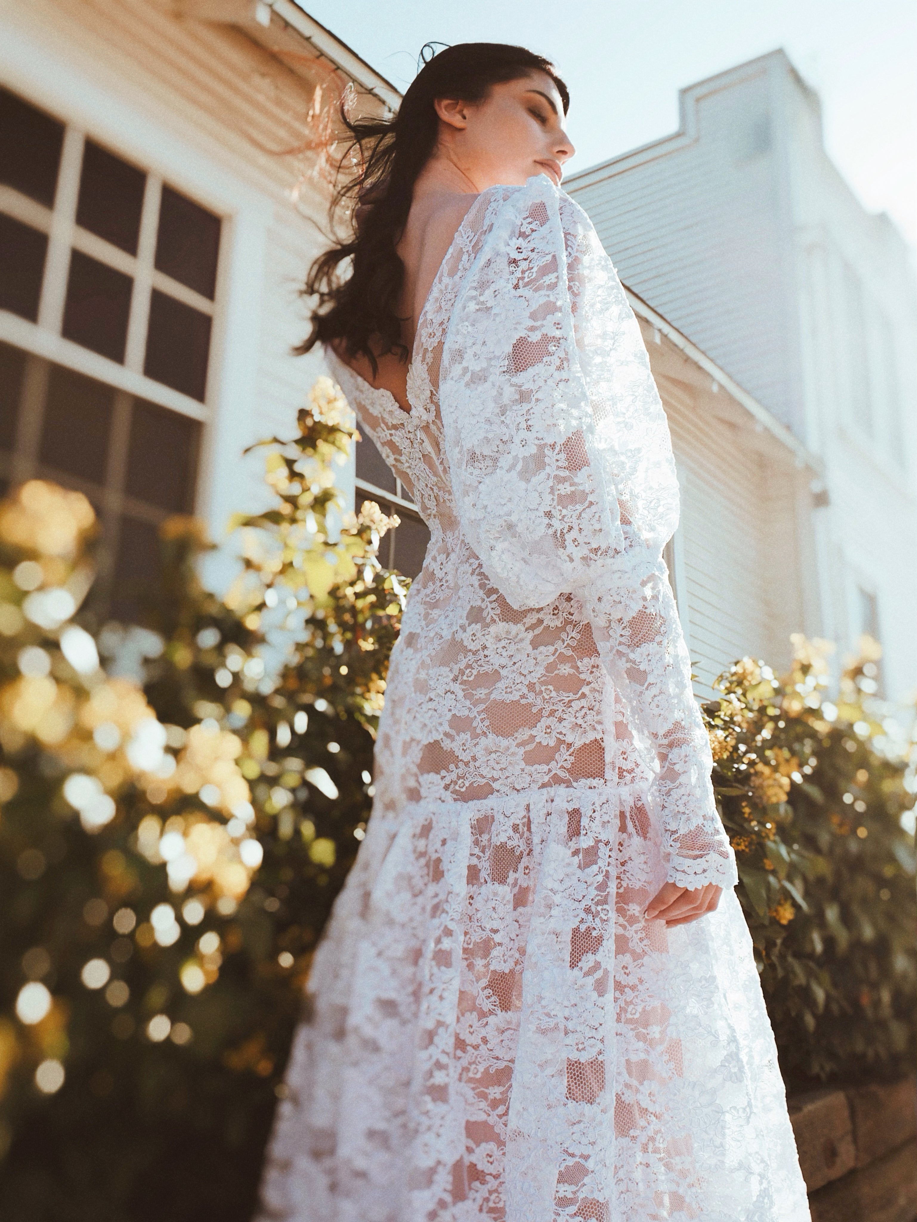 Bohemian and vintage long sleeve lace wedding dress by Lauren Elaine Bridal of Los Angeles.