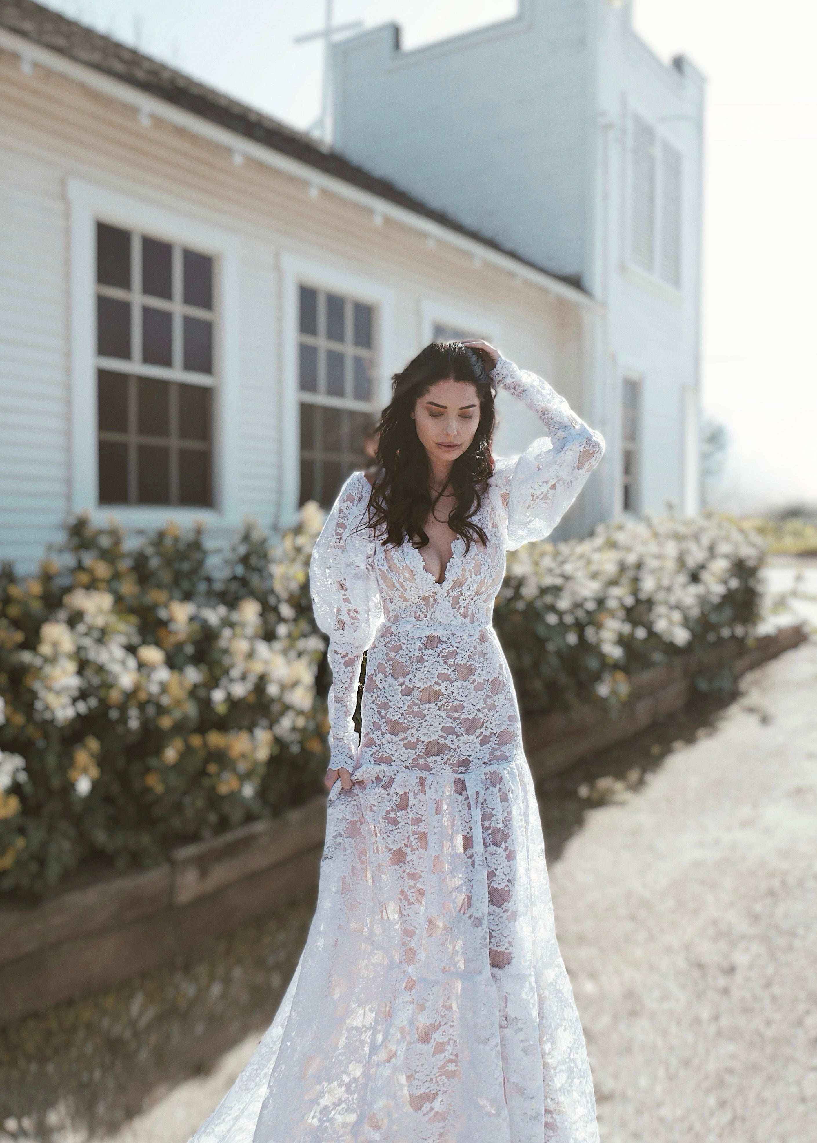 Romantic and vintage inspired lace wedding dress with long sleeves by Lauren Elaine.