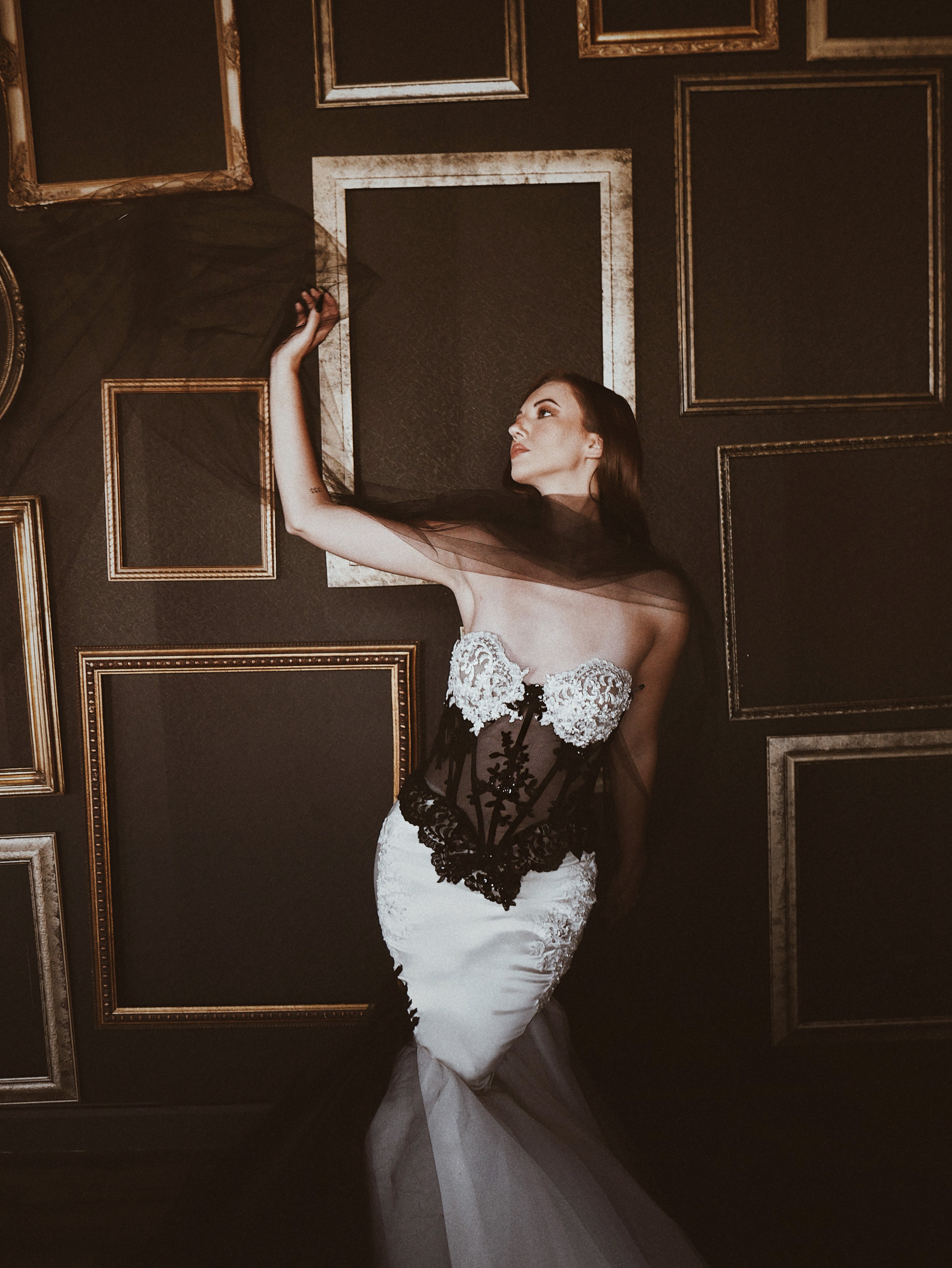 Basque waist lace corset wedding dress with lace peplum and satin hips by Lauren Elaine.
