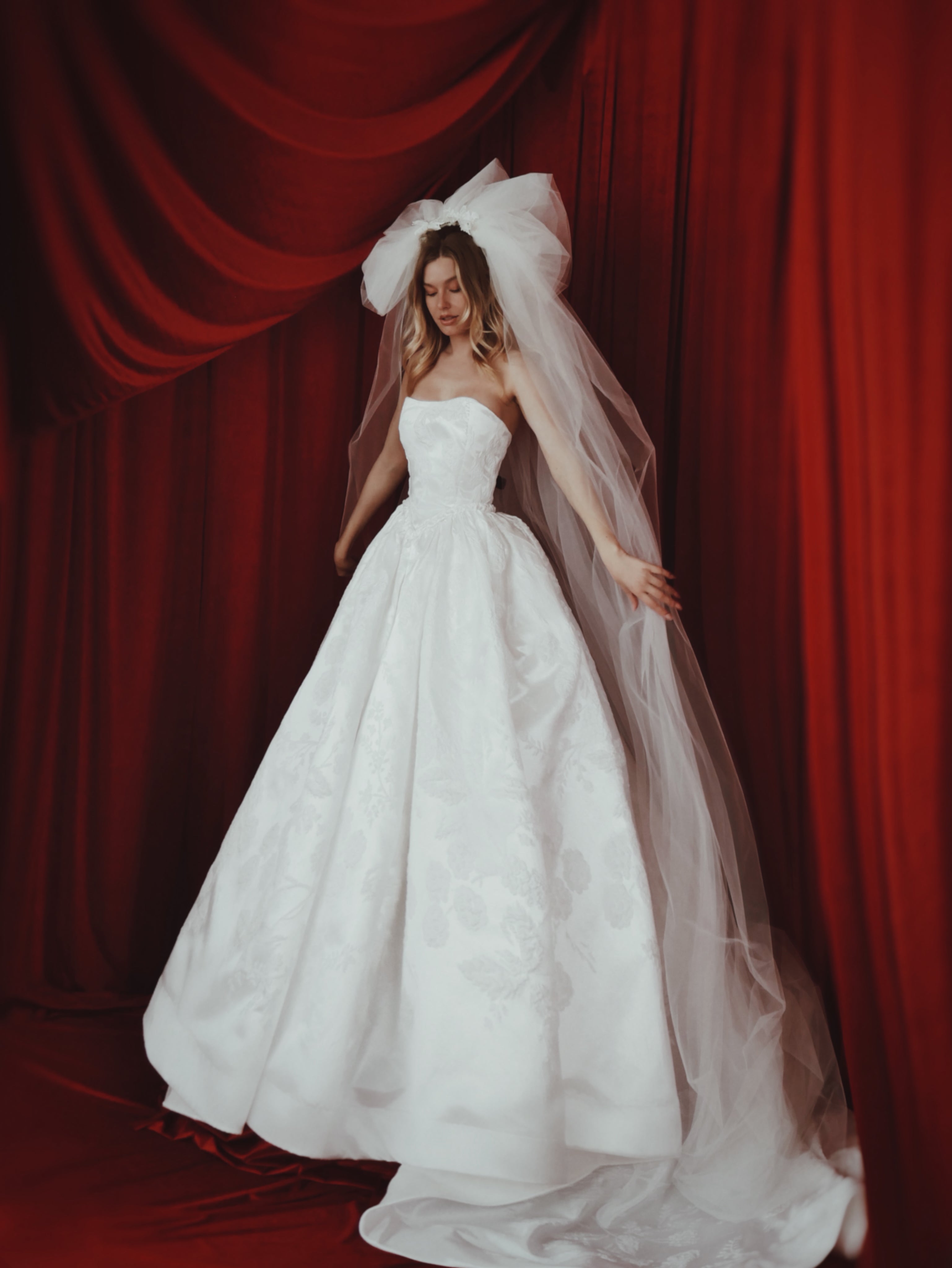 Full length view of a 1980s inspired pouf tulle bridal veil with dramatic train.