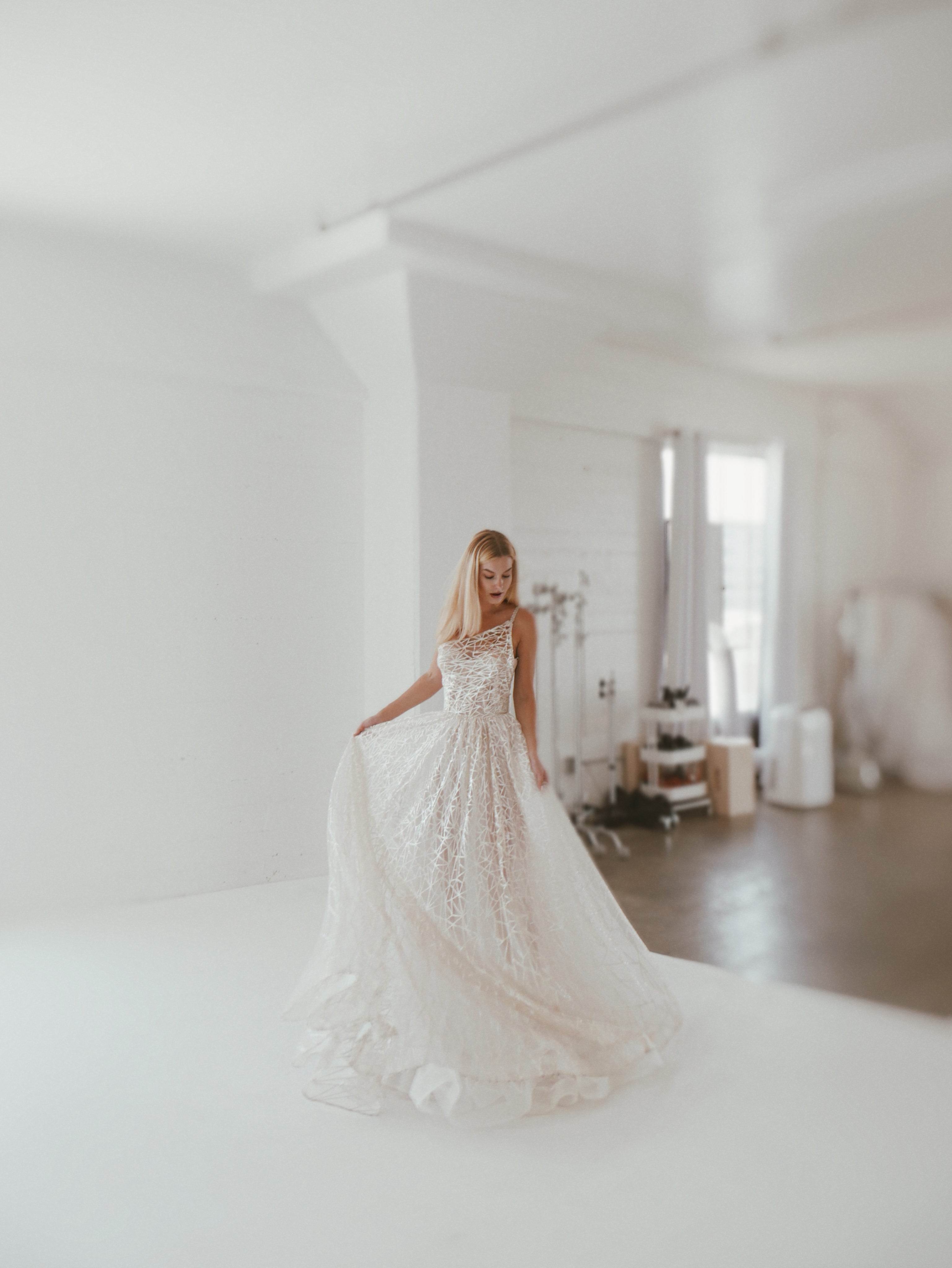 In the studio with Lauren Elaine Bridal in Los Angeles featuring the Prima wedding gown