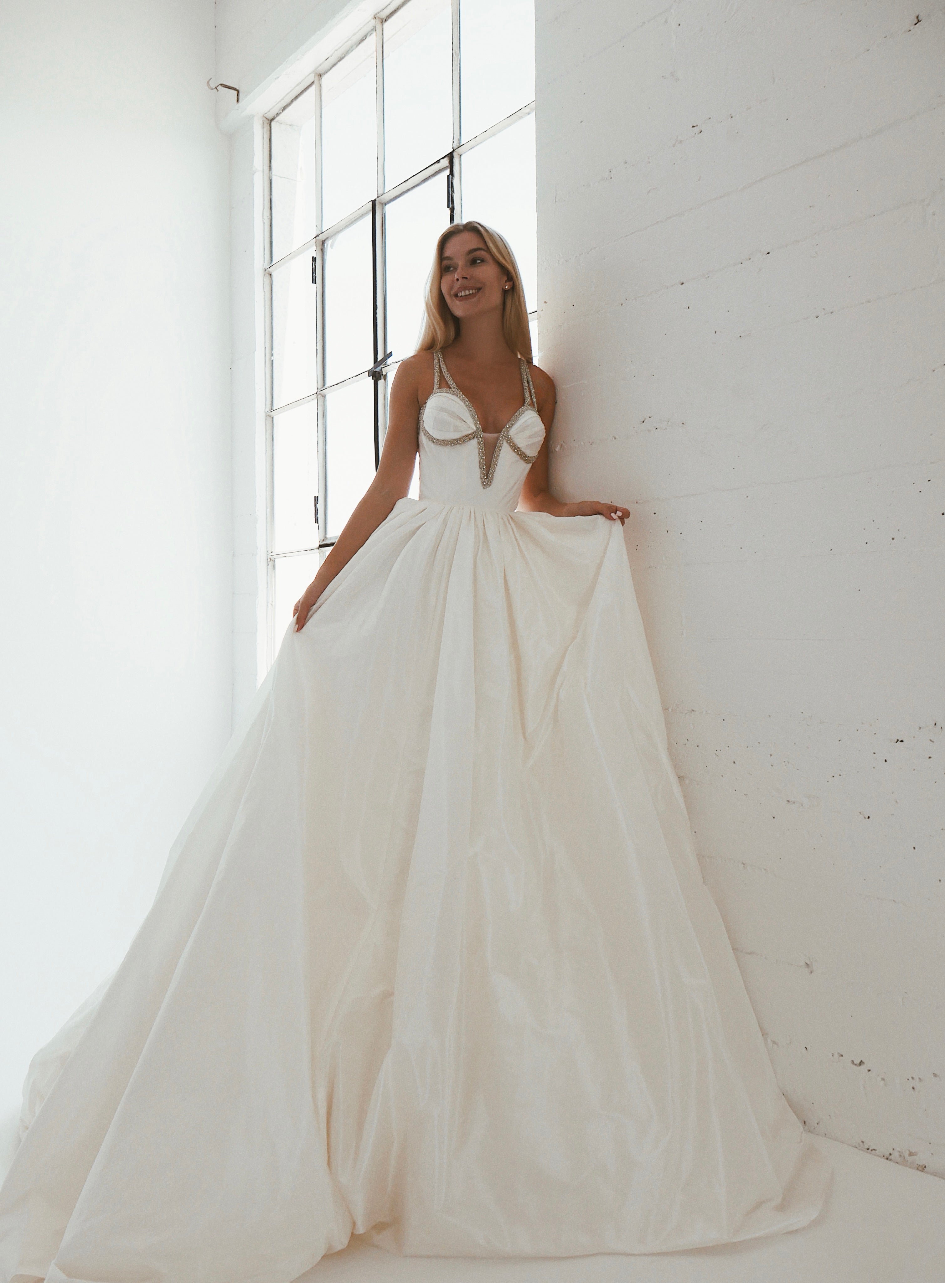 A clean and classic silk taffeta corset ball gown wedding dress by Lauren Elaine Los Angeles.