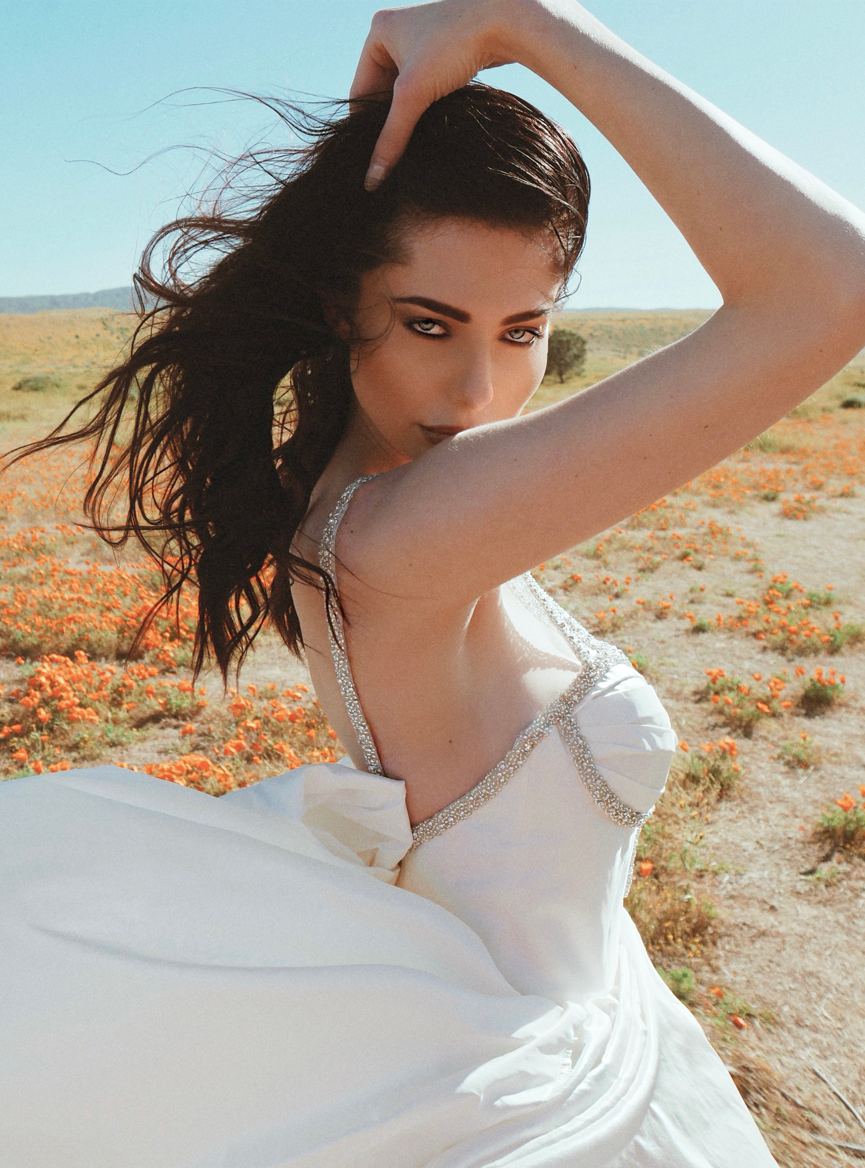 A model wears the silk taffeta corset ball gown wedding dress called Vespertine by Lauren Elaine