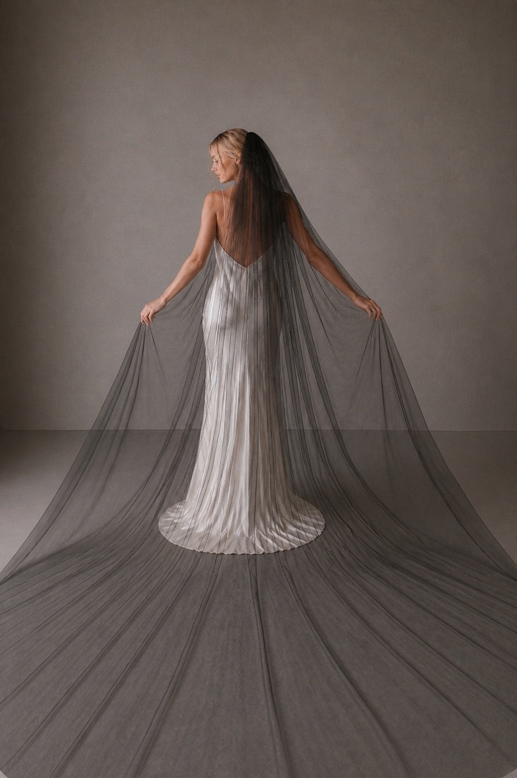 black classic tulle wedding veil full width cathedral length raw edge bridal veil back view